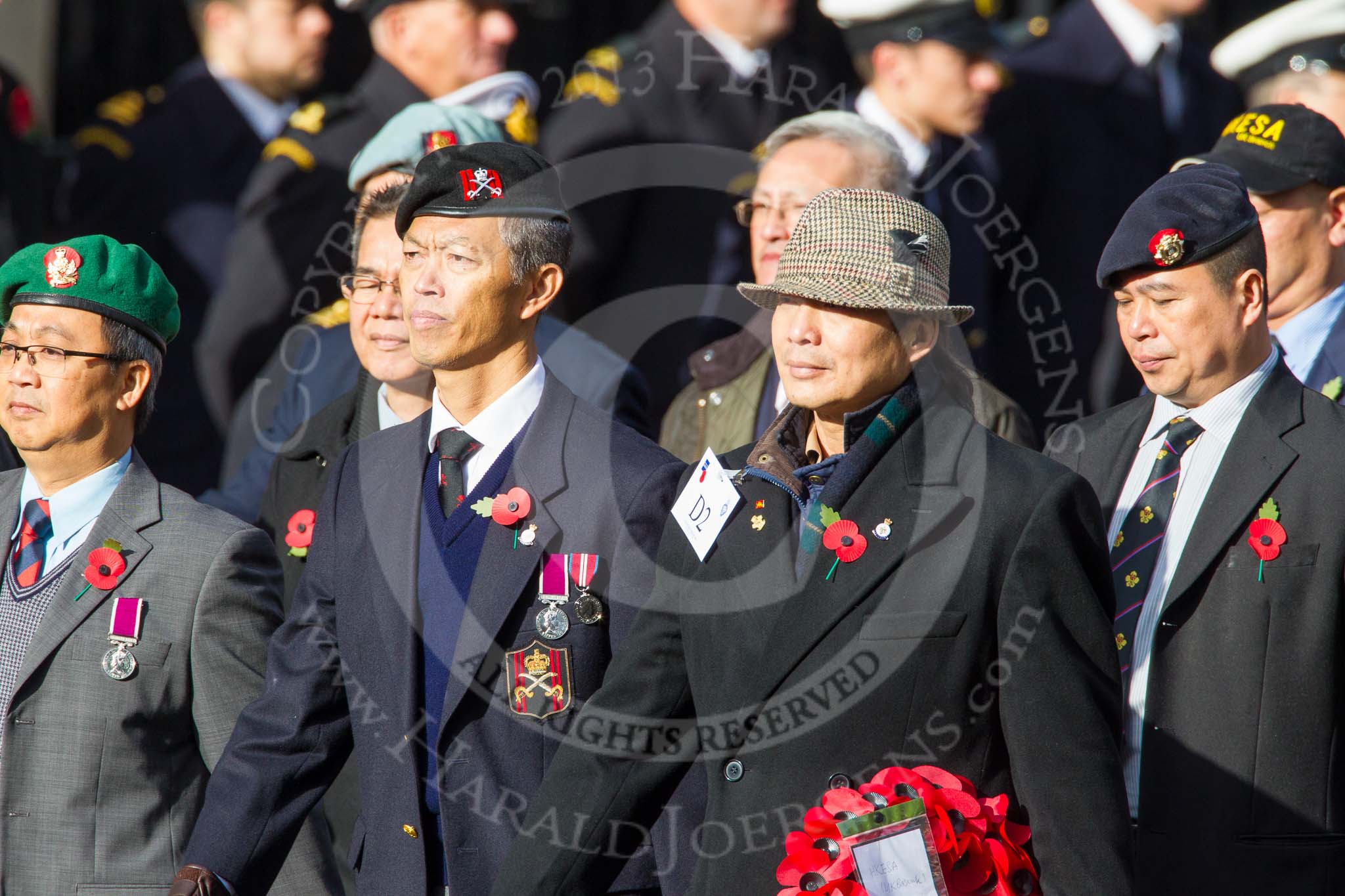 Remembrance Sunday at the Cenotaph in London 2014: Group D2 - Hong Kong Ex-Servicemen's Association (UK Branch).
Press stand opposite the Foreign Office building, Whitehall, London SW1,
London,
Greater London,
United Kingdom,
on 09 November 2014 at 11:43, image #279
