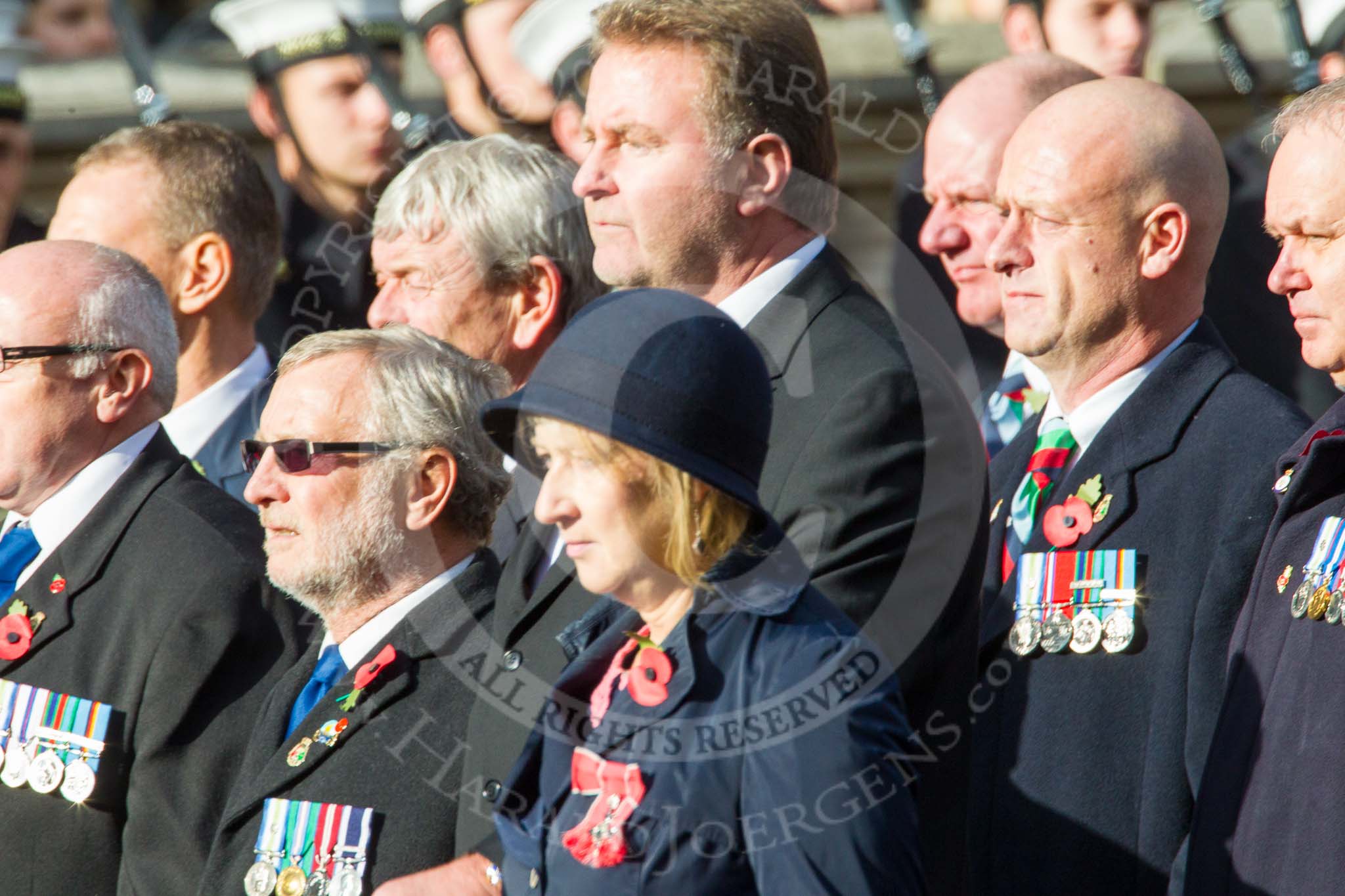 Remembrance Sunday at the Cenotaph in London 2014: Group D19 - South Atlantic Medal Association.
Press stand opposite the Foreign Office building, Whitehall, London SW1,
London,
Greater London,
United Kingdom,
on 09 November 2014 at 11:46, image #387