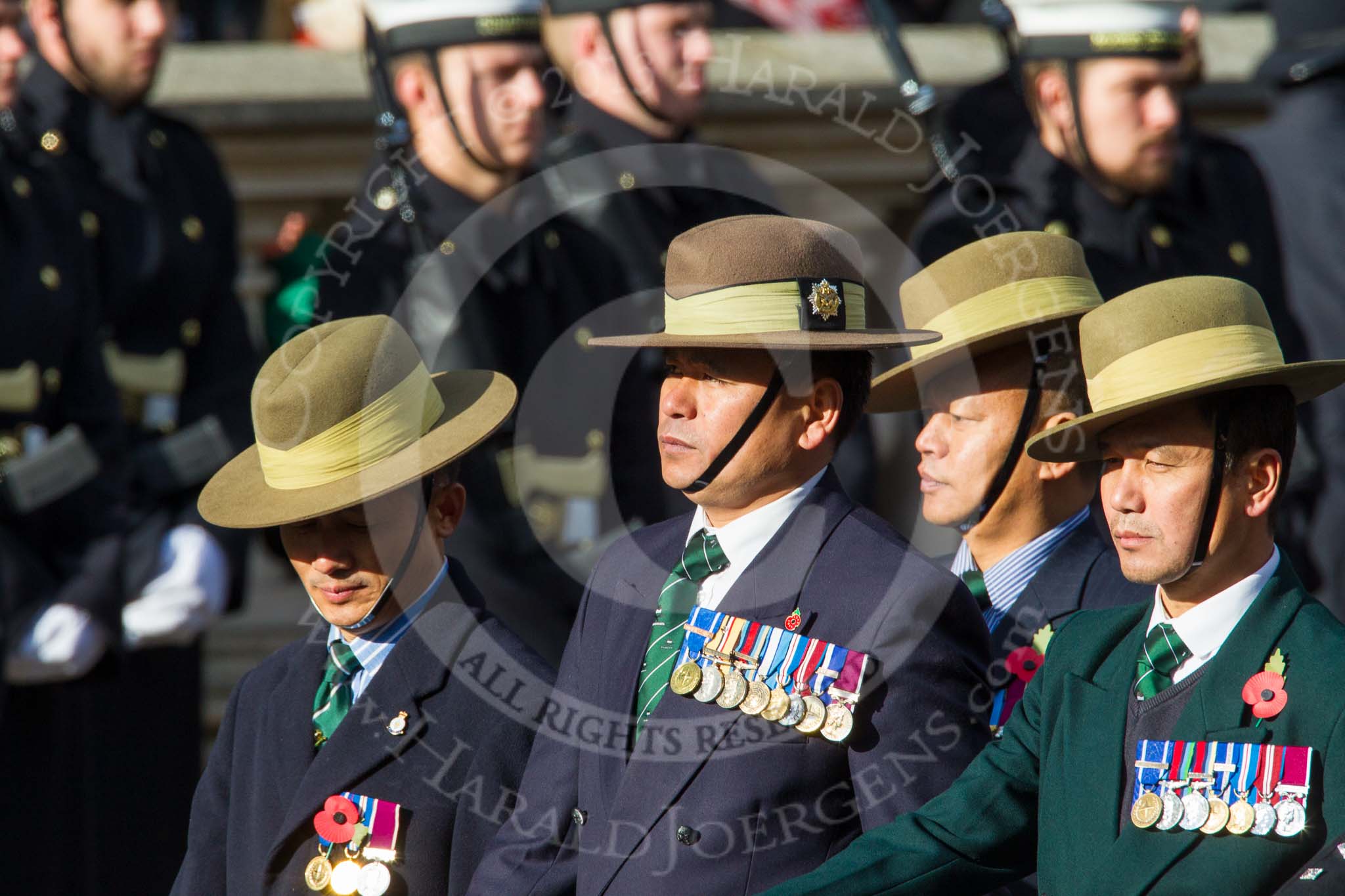 Remembrance Sunday at the Cenotaph in London 2014: Group D26 - British Gurkha Welfare Society.
Press stand opposite the Foreign Office building, Whitehall, London SW1,
London,
Greater London,
United Kingdom,
on 09 November 2014 at 11:47, image #478