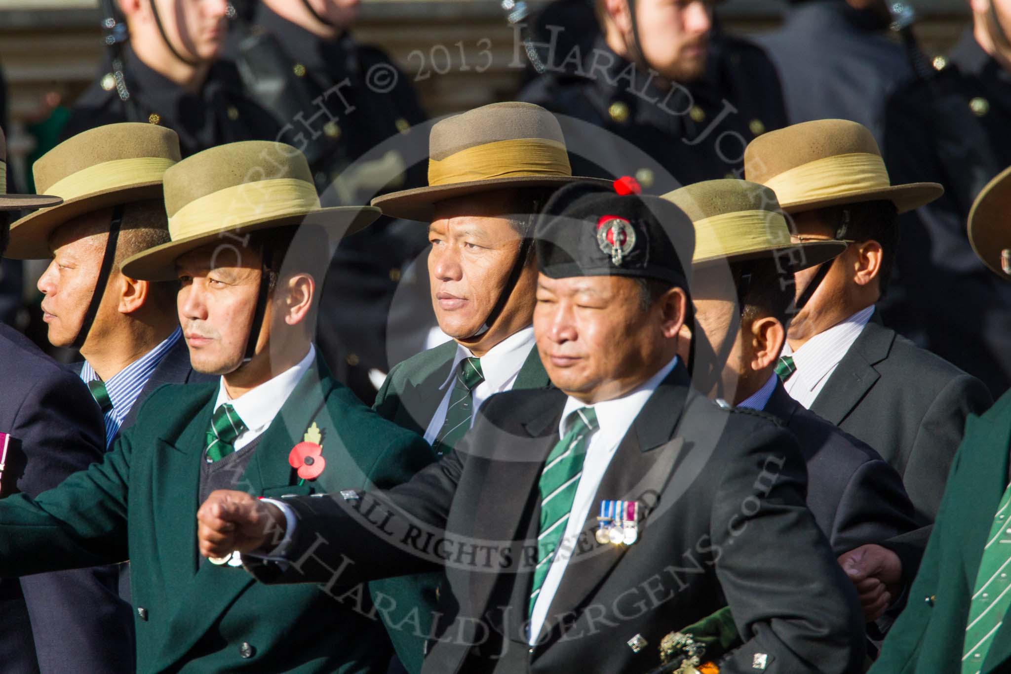 Remembrance Sunday at the Cenotaph in London 2014: Group D26 - British Gurkha Welfare Society.
Press stand opposite the Foreign Office building, Whitehall, London SW1,
London,
Greater London,
United Kingdom,
on 09 November 2014 at 11:47, image #479