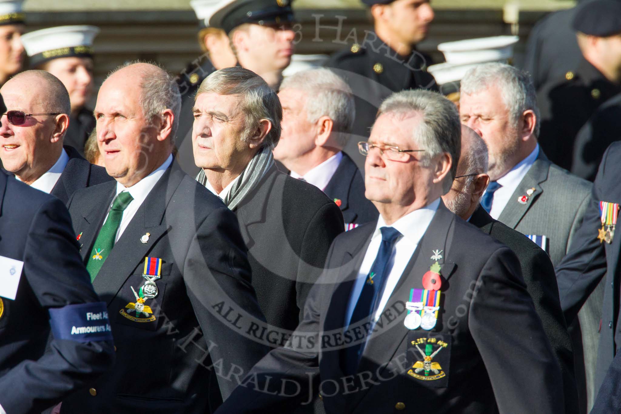 Remembrance Sunday at the Cenotaph in London 2014: Group E4 - Fleet Air Arm Armourers Association.
Press stand opposite the Foreign Office building, Whitehall, London SW1,
London,
Greater London,
United Kingdom,
on 09 November 2014 at 11:50, image #619