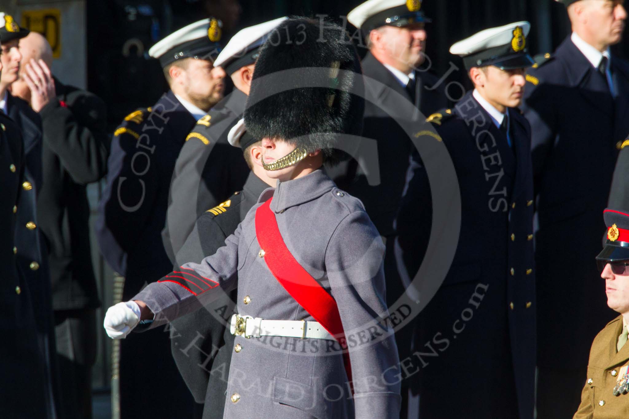Remembrance Sunday at the Cenotaph in London 2014: An army sergeant marches in front of the next column.
Press stand opposite the Foreign Office building, Whitehall, London SW1,
London,
Greater London,
United Kingdom,
on 09 November 2014 at 11:55, image #878