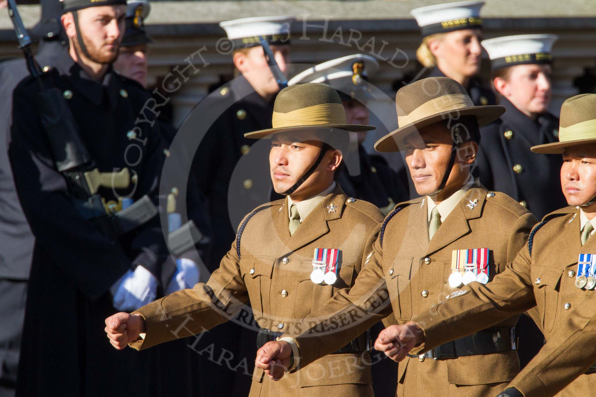 Remembrance Sunday at the Cenotaph in London 2014: Group F14 - National Malaya & Borneo Veterans Association.
Press stand opposite the Foreign Office building, Whitehall, London SW1,
London,
Greater London,
United Kingdom,
on 09 November 2014 at 11:58, image #1013