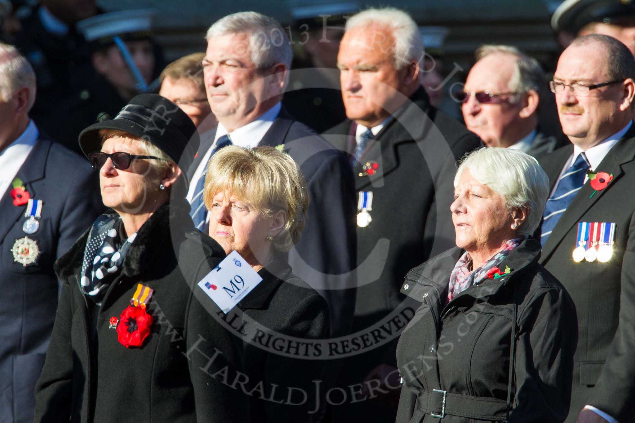 Remembrance Sunday at the Cenotaph in London 2014: Group M9 - Royal Voluntary Service.
Press stand opposite the Foreign Office building, Whitehall, London SW1,
London,
Greater London,
United Kingdom,
on 09 November 2014 at 12:16, image #2045