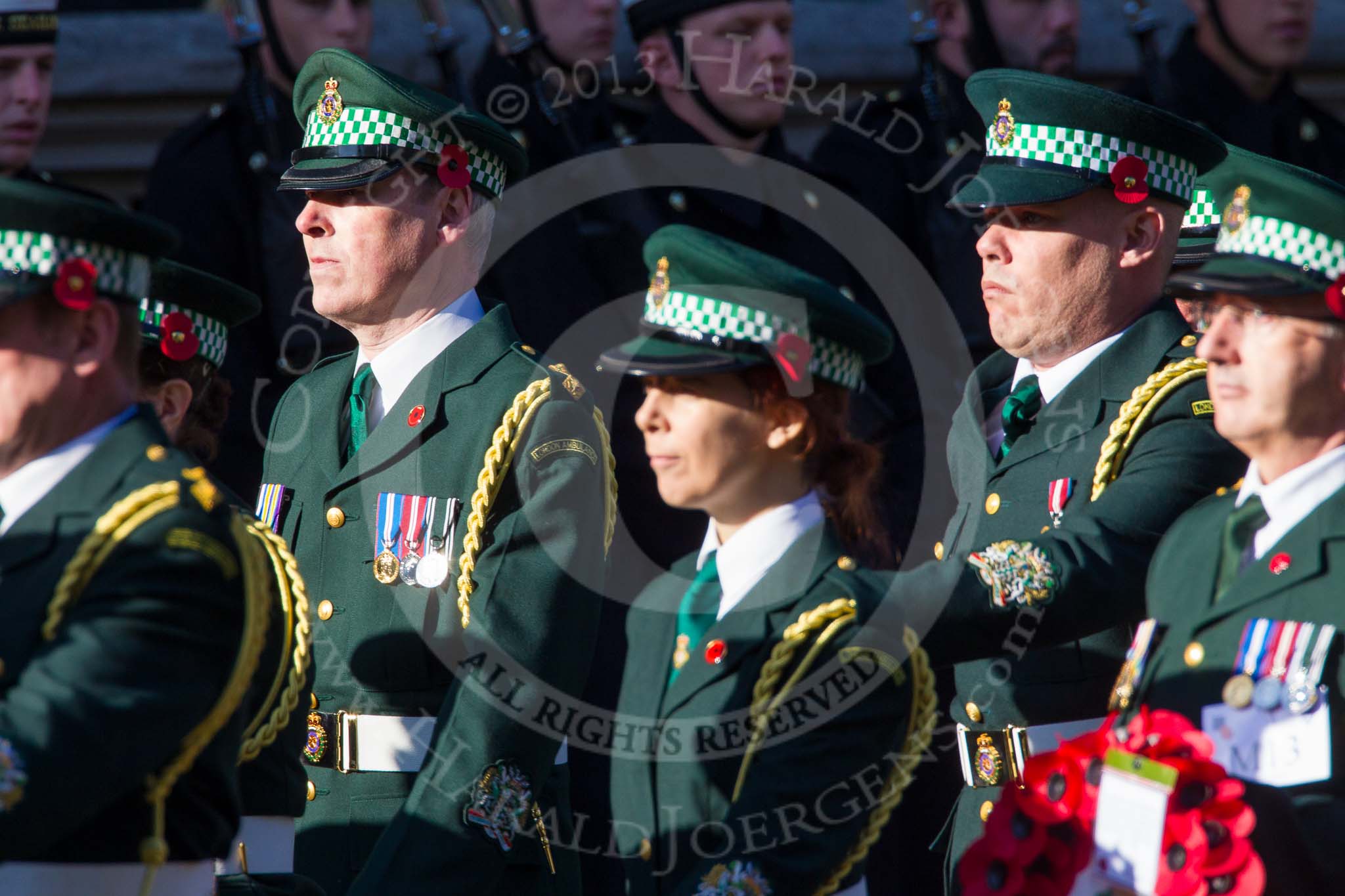 Remembrance Sunday at the Cenotaph in London 2014: Group M13 - London Ambulance Service NHS Trust.
Press stand opposite the Foreign Office building, Whitehall, London SW1,
London,
Greater London,
United Kingdom,
on 09 November 2014 at 12:16, image #2073