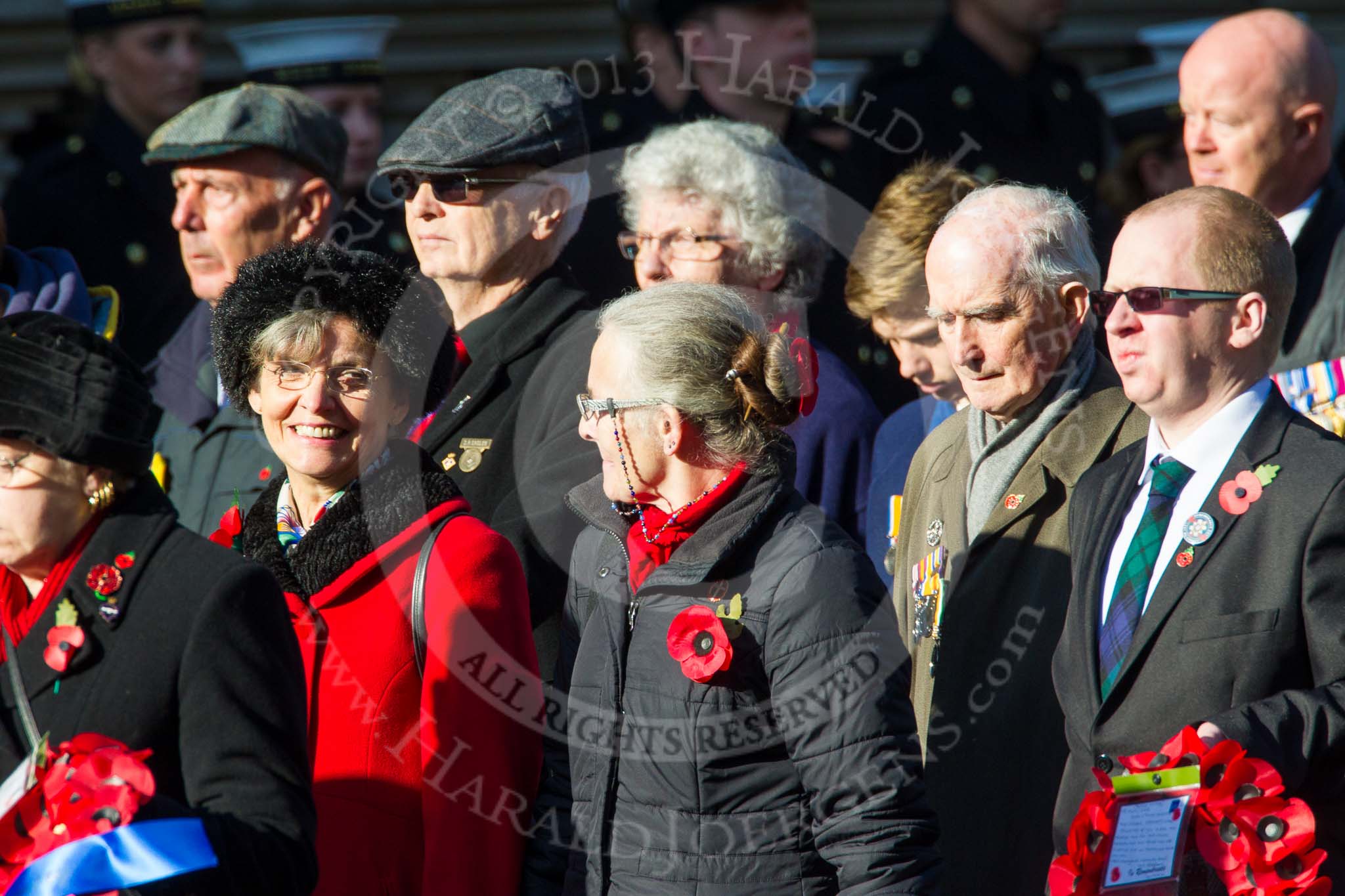 Remembrance Sunday at the Cenotaph in London 2014: Group M23 - Civilians Representing Families.
Press stand opposite the Foreign Office building, Whitehall, London SW1,
London,
Greater London,
United Kingdom,
on 09 November 2014 at 12:18, image #2150