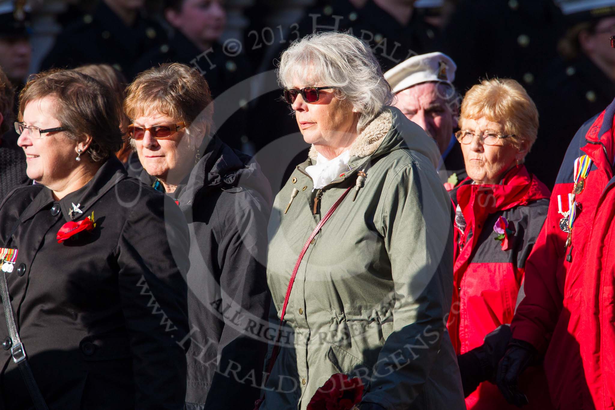 Remembrance Sunday at the Cenotaph in London 2014: Group M23 - Civilians Representing Families.
Press stand opposite the Foreign Office building, Whitehall, London SW1,
London,
Greater London,
United Kingdom,
on 09 November 2014 at 12:18, image #2165