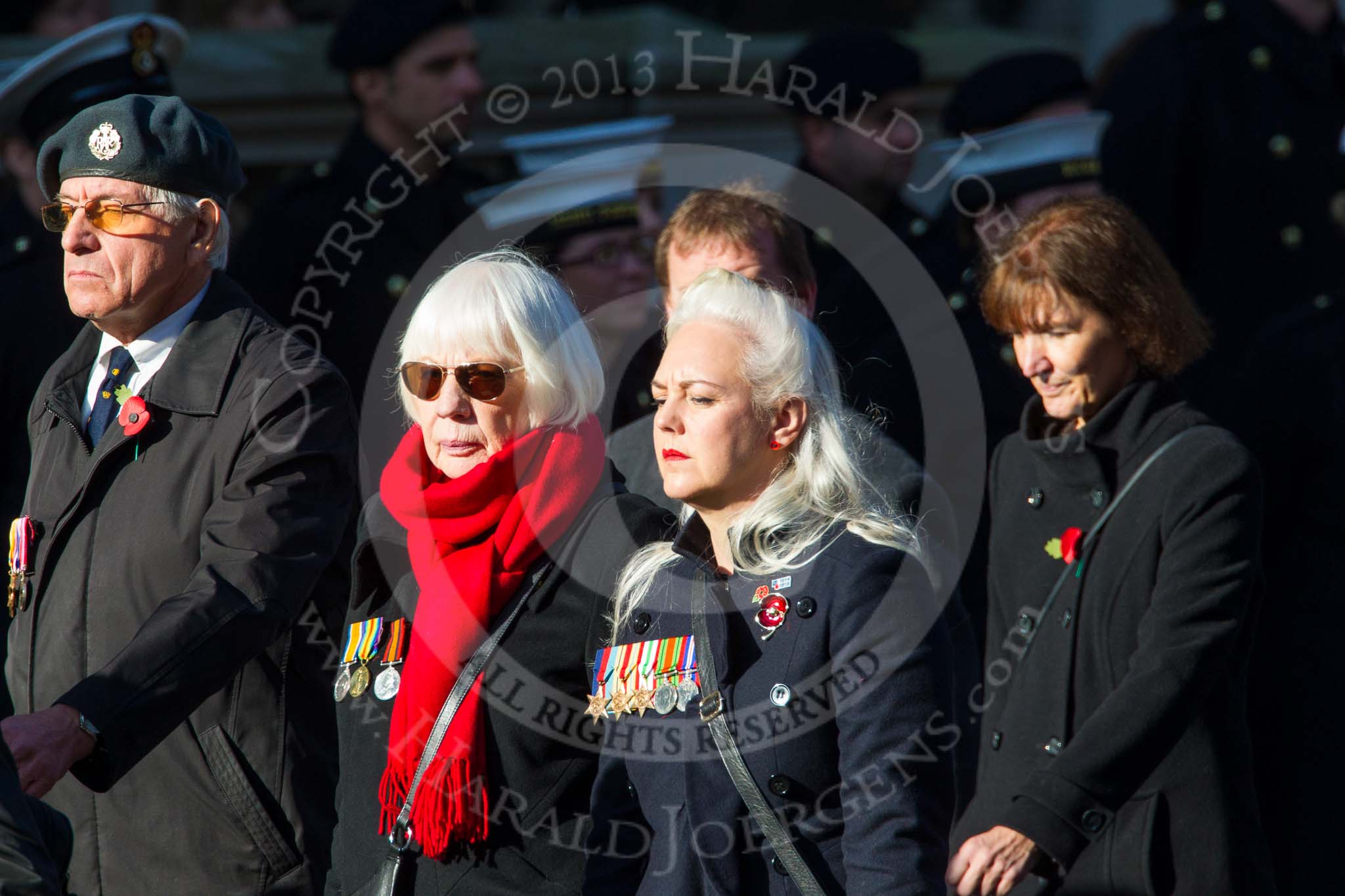 Remembrance Sunday at the Cenotaph in London 2014: Group M23 - Civilians Representing Families.
Press stand opposite the Foreign Office building, Whitehall, London SW1,
London,
Greater London,
United Kingdom,
on 09 November 2014 at 12:18, image #2182