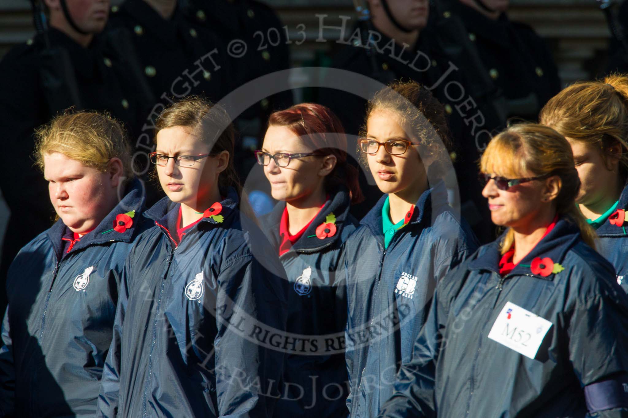Remembrance Sunday at the Cenotaph in London 2014: Group M52 - Girls Brigade England & Wales.
Press stand opposite the Foreign Office building, Whitehall, London SW1,
London,
Greater London,
United Kingdom,
on 09 November 2014 at 12:21, image #2333