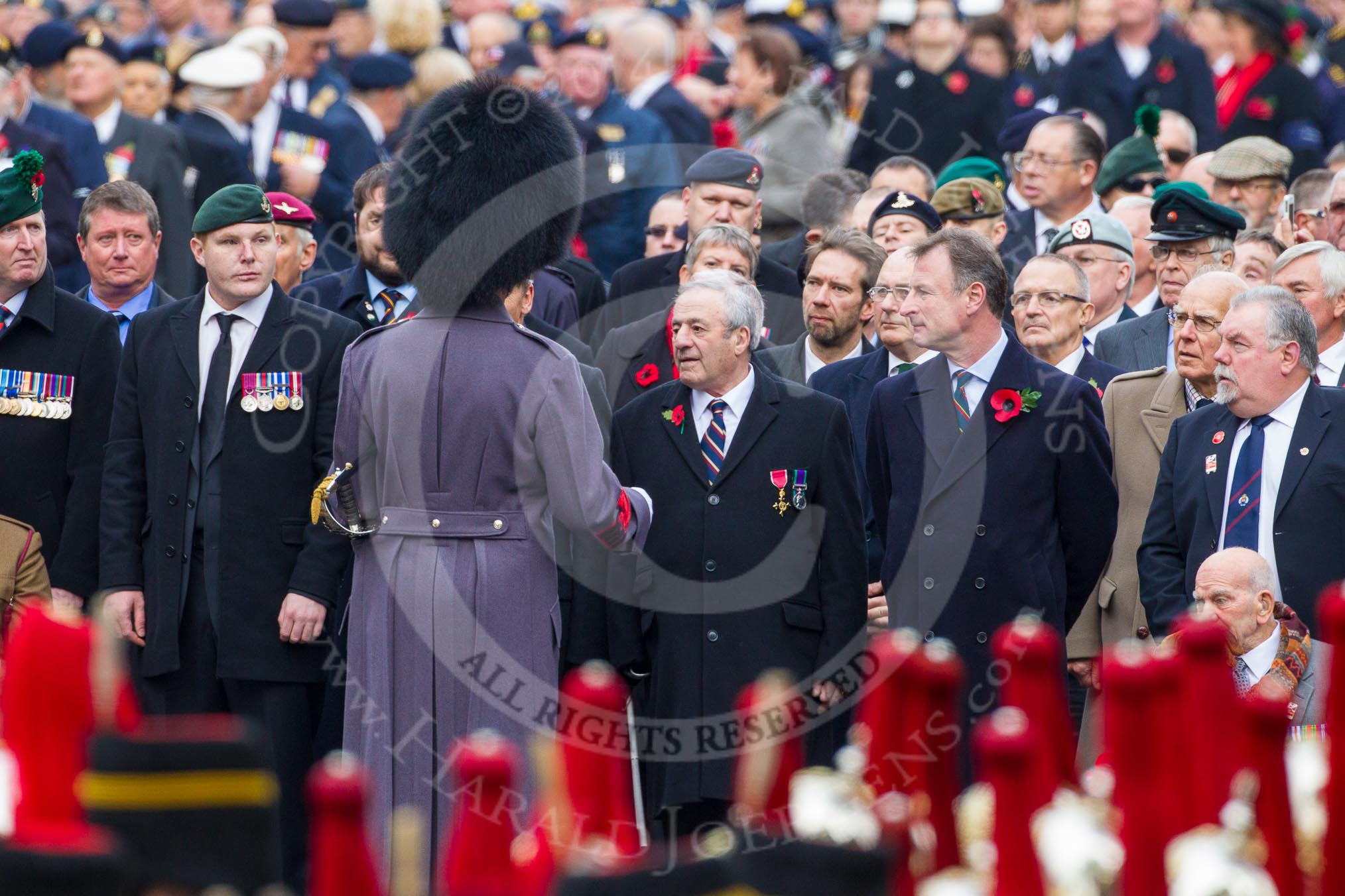 Remembrance Sunday at the Cenotaph in London 2014: GSM William Mott talking to the waiting veterans before the start of the event.
Press stand opposite the Foreign Office building, Whitehall, London SW1,
London,
Greater London,
United Kingdom,
on 09 November 2014 at 10:39, image #80