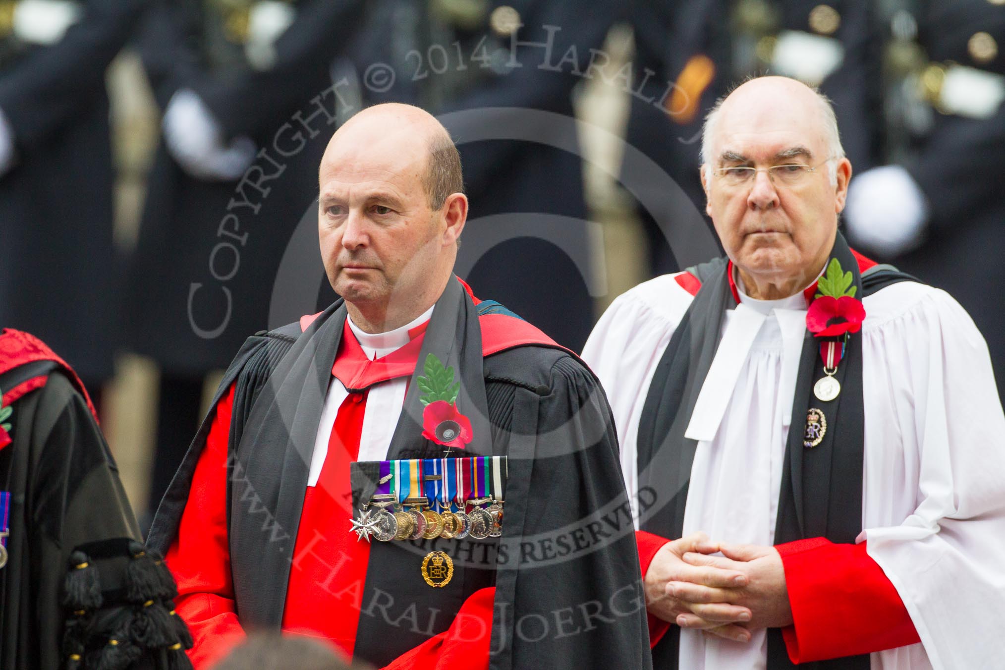 Remembrance Sunday at the Cenotaph in London 2014: The Chaplain General to HM Land Forces, Reverend Dr David George Coulter, behind him the Sub-Dean of Her Majesty's Chapels Royal, the Reverend Prebendary William Scott.
Press stand opposite the Foreign Office building, Whitehall, London SW1,
London,
Greater London,
United Kingdom,
on 09 November 2014 at 10:54, image #113