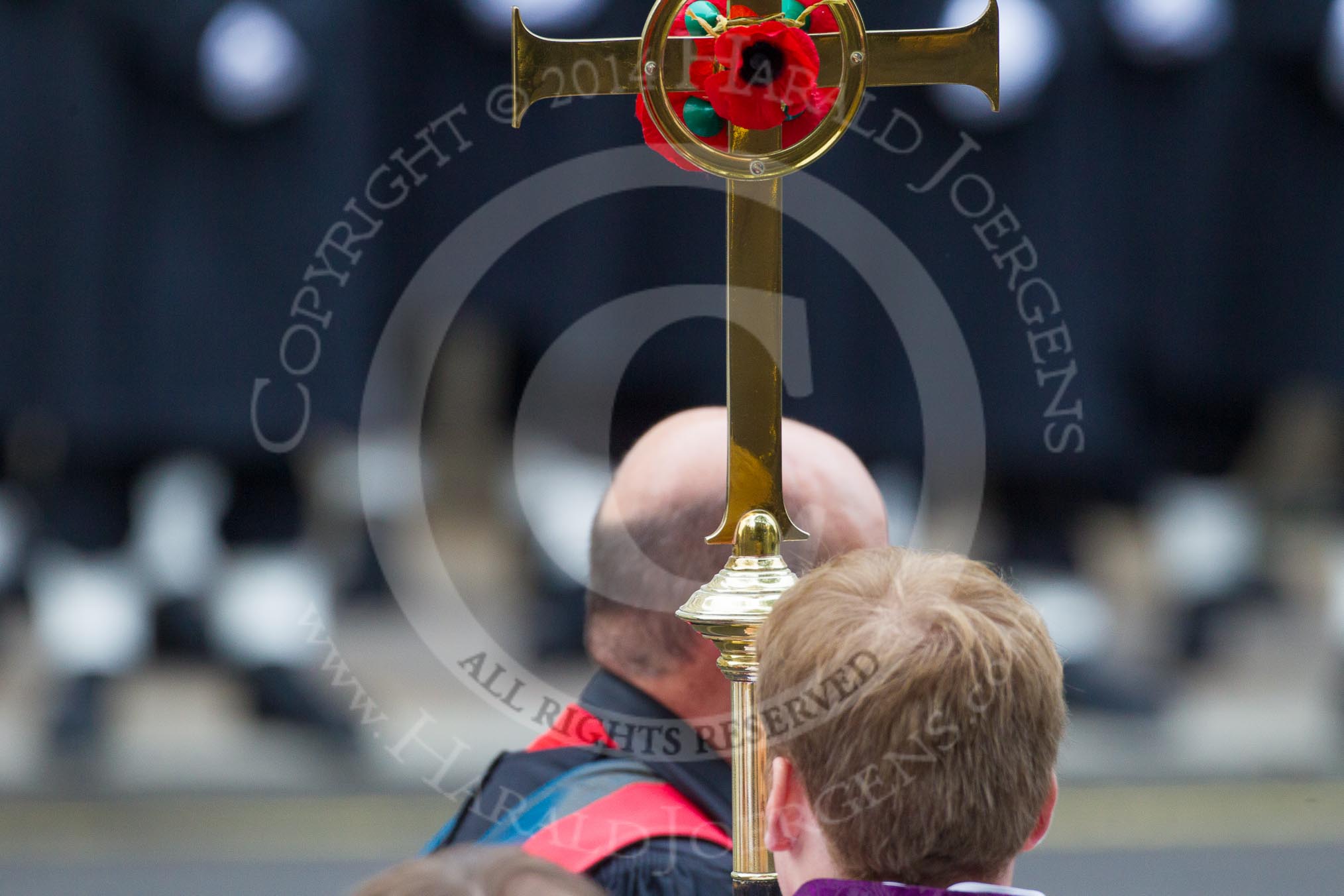 Remembrance Sunday at the Cenotaph in London 2014: The golden cross with the red poppies, carried by the Cross Bearer.
Press stand opposite the Foreign Office building, Whitehall, London SW1,
London,
Greater London,
United Kingdom,
on 09 November 2014 at 10:54, image #118