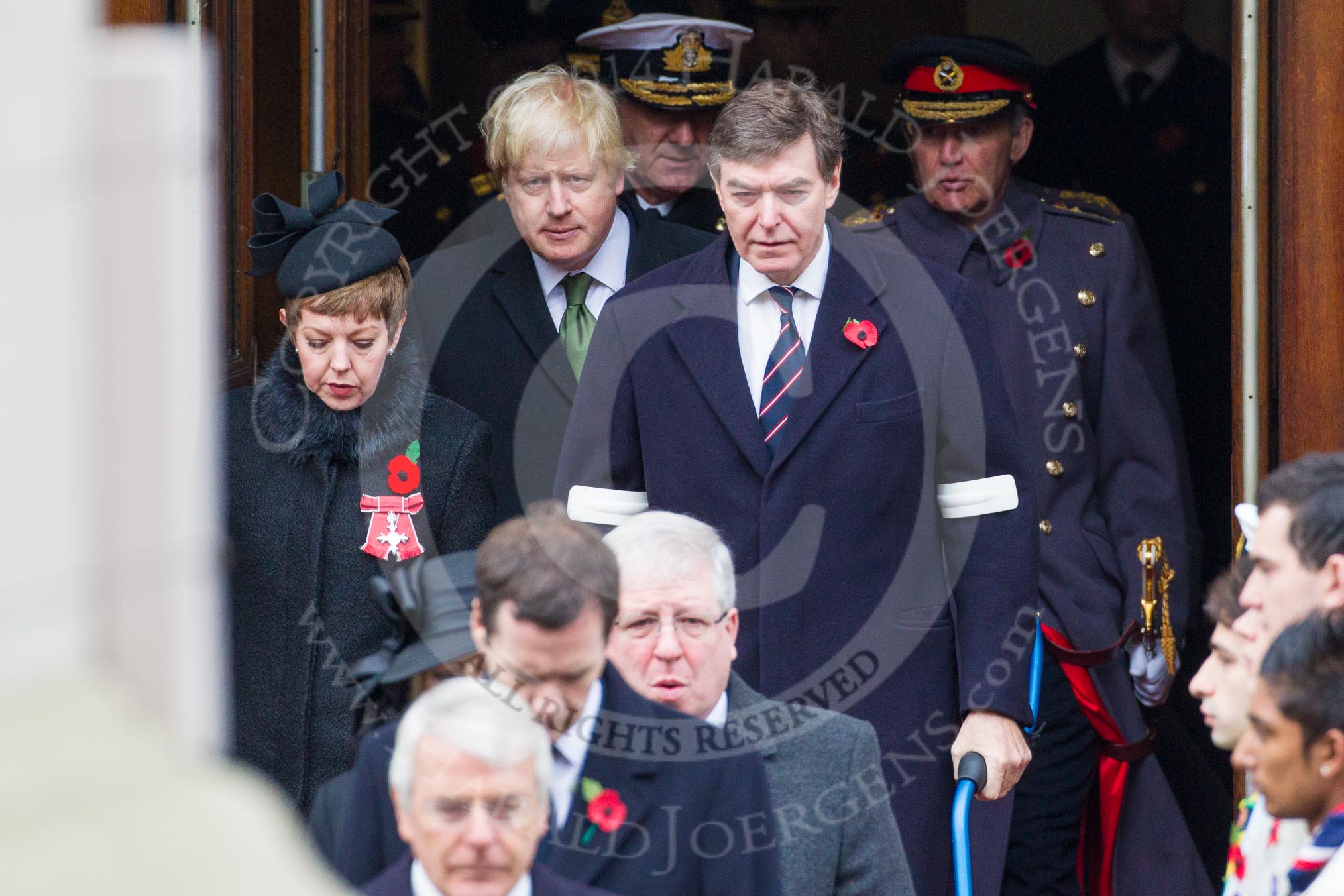 Remembrance Sunday at the Cenotaph in London 2014: The politicians emerging from the door of the Foreign- and Commonwealth Office, amongst them Boris Johnson, the London Mayor.
Press stand opposite the Foreign Office building, Whitehall, London SW1,
London,
Greater London,
United Kingdom,
on 09 November 2014 at 10:55, image #124