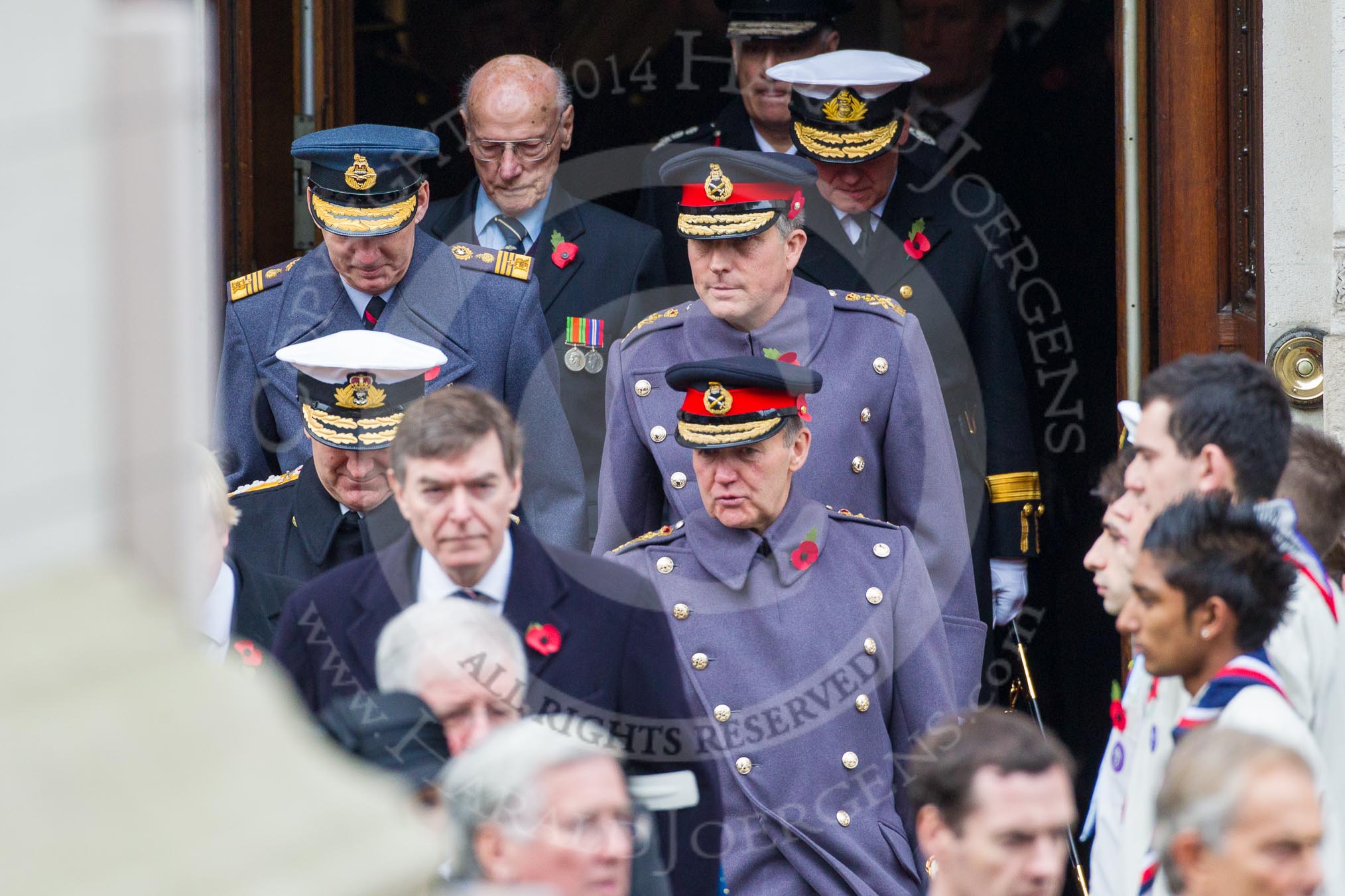 Remembrance Sunday at the Cenotaph in London 2014: The military leaders emerging from the door of the Foreign- and Commonwealth Office.
Press stand opposite the Foreign Office building, Whitehall, London SW1,
London,
Greater London,
United Kingdom,
on 09 November 2014 at 10:56, image #125