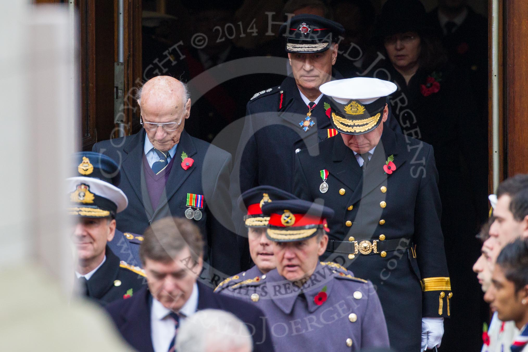 Remembrance Sunday at the Cenotaph in London 2014: The military leaders emerging from the door of the Foreign- and Commonwealth Office.
Press stand opposite the Foreign Office building, Whitehall, London SW1,
London,
Greater London,
United Kingdom,
on 09 November 2014 at 10:56, image #126