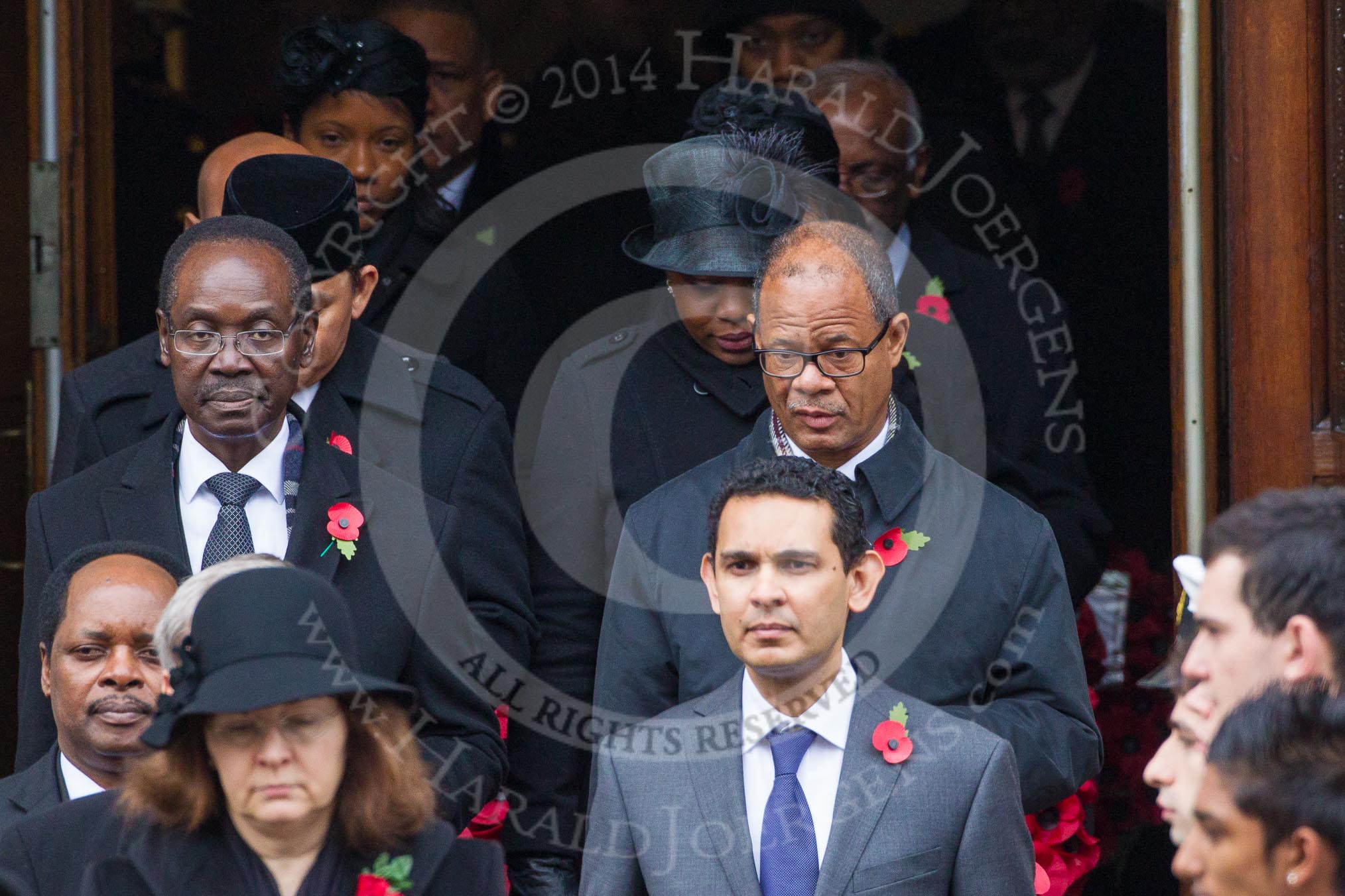 Remembrance Sunday at the Cenotaph in London 2014: The High Commissioners emerging from the door of the Foreign- and Commonwealth Office.
Press stand opposite the Foreign Office building, Whitehall, London SW1,
London,
Greater London,
United Kingdom,
on 09 November 2014 at 10:56, image #128