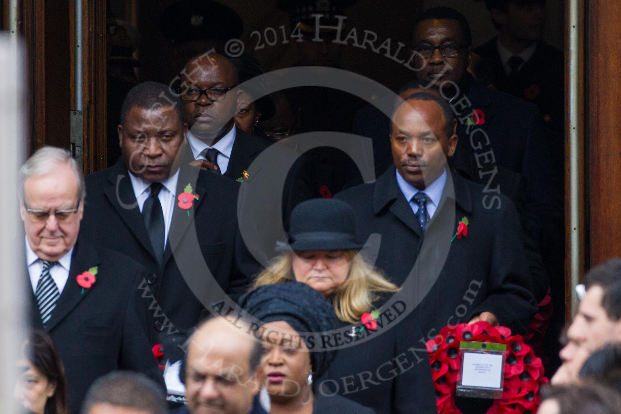 Remembrance Sunday at the Cenotaph in London 2014: The High Commissioners emerging from the door of the Foreign- and Commonwealth Office.
Press stand opposite the Foreign Office building, Whitehall, London SW1,
London,
Greater London,
United Kingdom,
on 09 November 2014 at 10:56, image #133