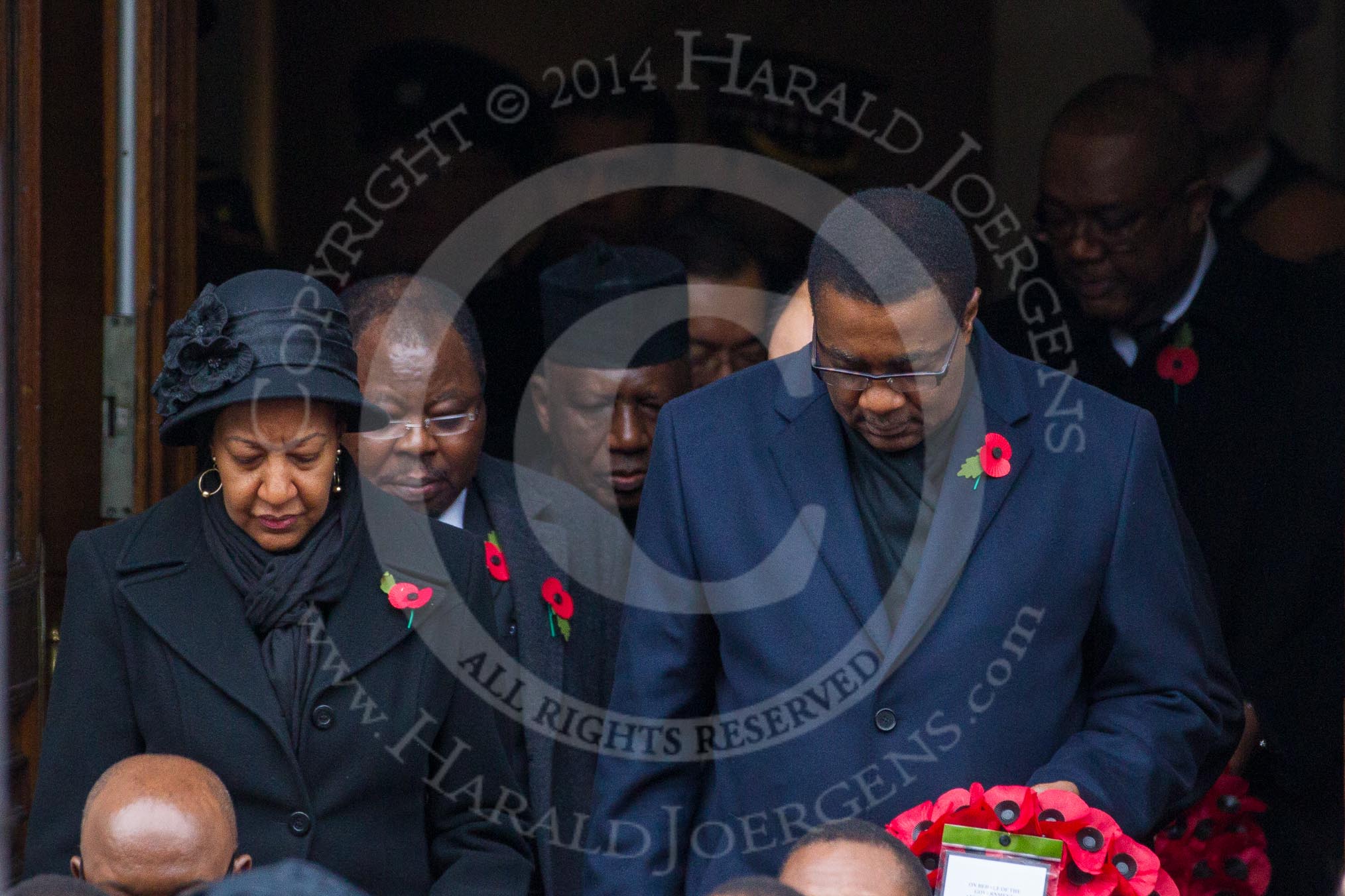Remembrance Sunday at the Cenotaph in London 2014: The High Commissioners emerging from the door of the Foreign- and Commonwealth Office.
Press stand opposite the Foreign Office building, Whitehall, London SW1,
London,
Greater London,
United Kingdom,
on 09 November 2014 at 10:56, image #134