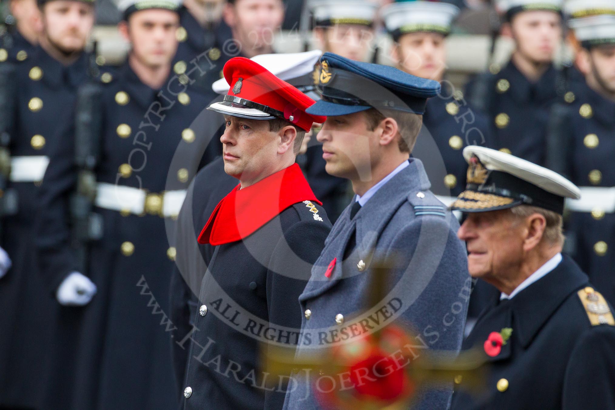 Remembrance Sunday at the Cenotaph in London 2014: HRH The Duke of Edinburgh, HRH The Duke of Cambridge, and HRH The Earl of Wessex, with the golden cross, out of focus, in front.
Press stand opposite the Foreign Office building, Whitehall, London SW1,
London,
Greater London,
United Kingdom,
on 09 November 2014 at 10:59, image #150