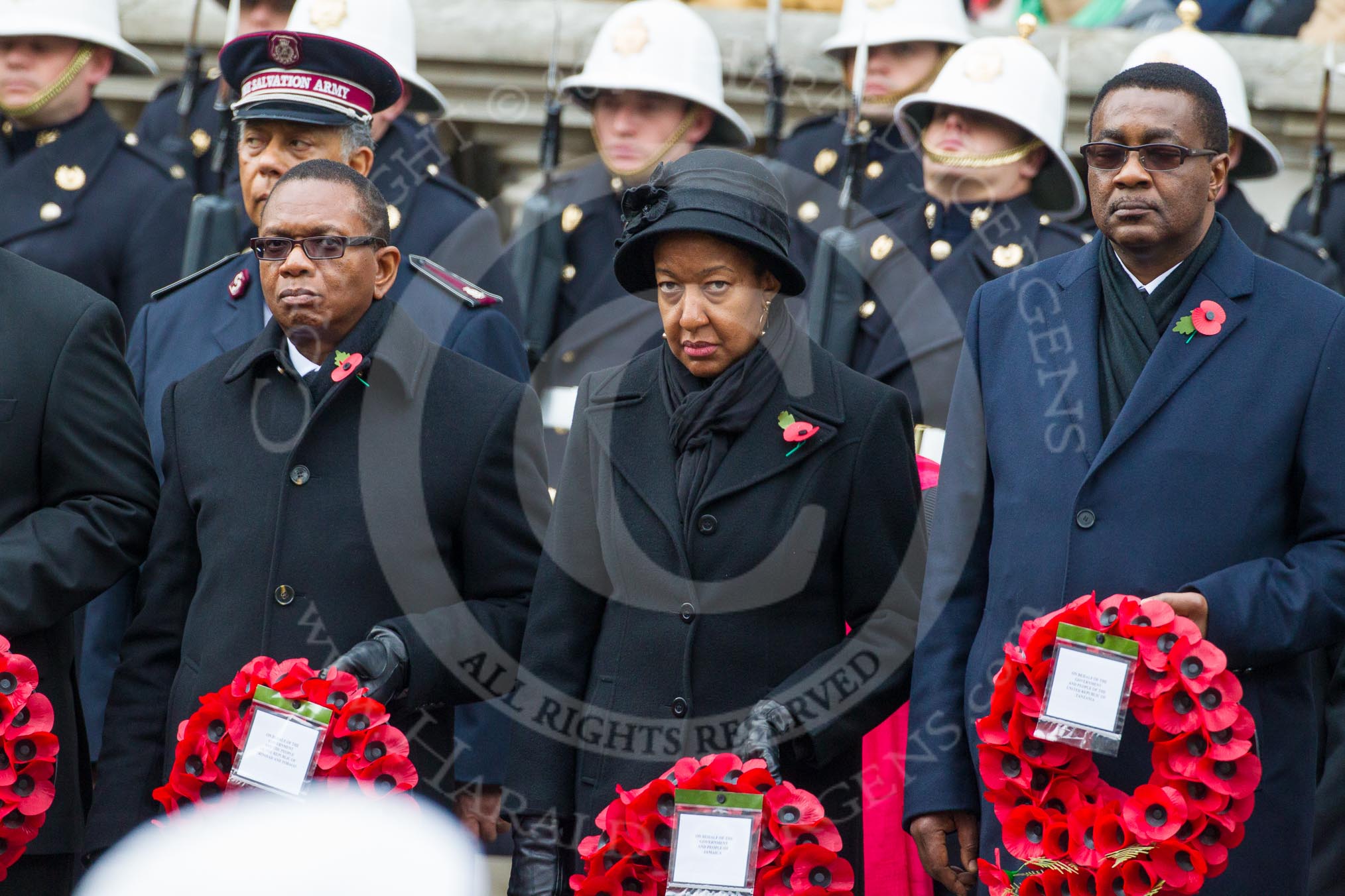 Remembrance Sunday at the Cenotaph in London 2014: The Acting High Commissioner of Trinidad and Tobago, the Counsellor of Jamaica, and the High Commissioner of Tanzania with their wreaths at the Cenotaph.
Press stand opposite the Foreign Office building, Whitehall, London SW1,
London,
Greater London,
United Kingdom,
on 09 November 2014 at 11:02, image #171
