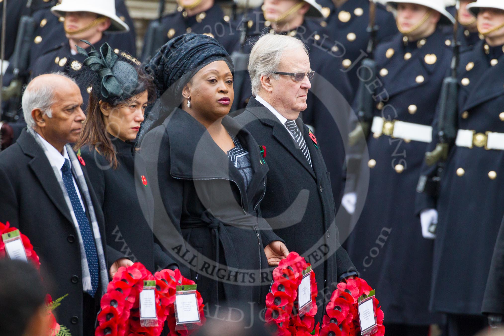Remembrance Sunday at the Cenotaph in London 2014: The High Commissioner of Guyana, the High Commissioner of Singapore, the High Commissioner of Zambia and and the High Commissioner of Malta with their wreaths at the Cenotaph.
Press stand opposite the Foreign Office building, Whitehall, London SW1,
London,
Greater London,
United Kingdom,
on 09 November 2014 at 11:03, image #174