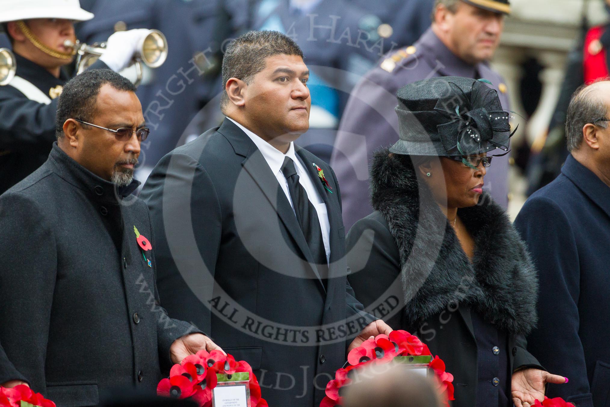 Remembrance Sunday at the Cenotaph in London 2014: The High Commissioner of Fiji, the High Commissioner of Tonga, and the High Commissioner of Swaziland with their wreaths at the Cenotaph.
Press stand opposite the Foreign Office building, Whitehall, London SW1,
London,
Greater London,
United Kingdom,
on 09 November 2014 at 11:03, image #178