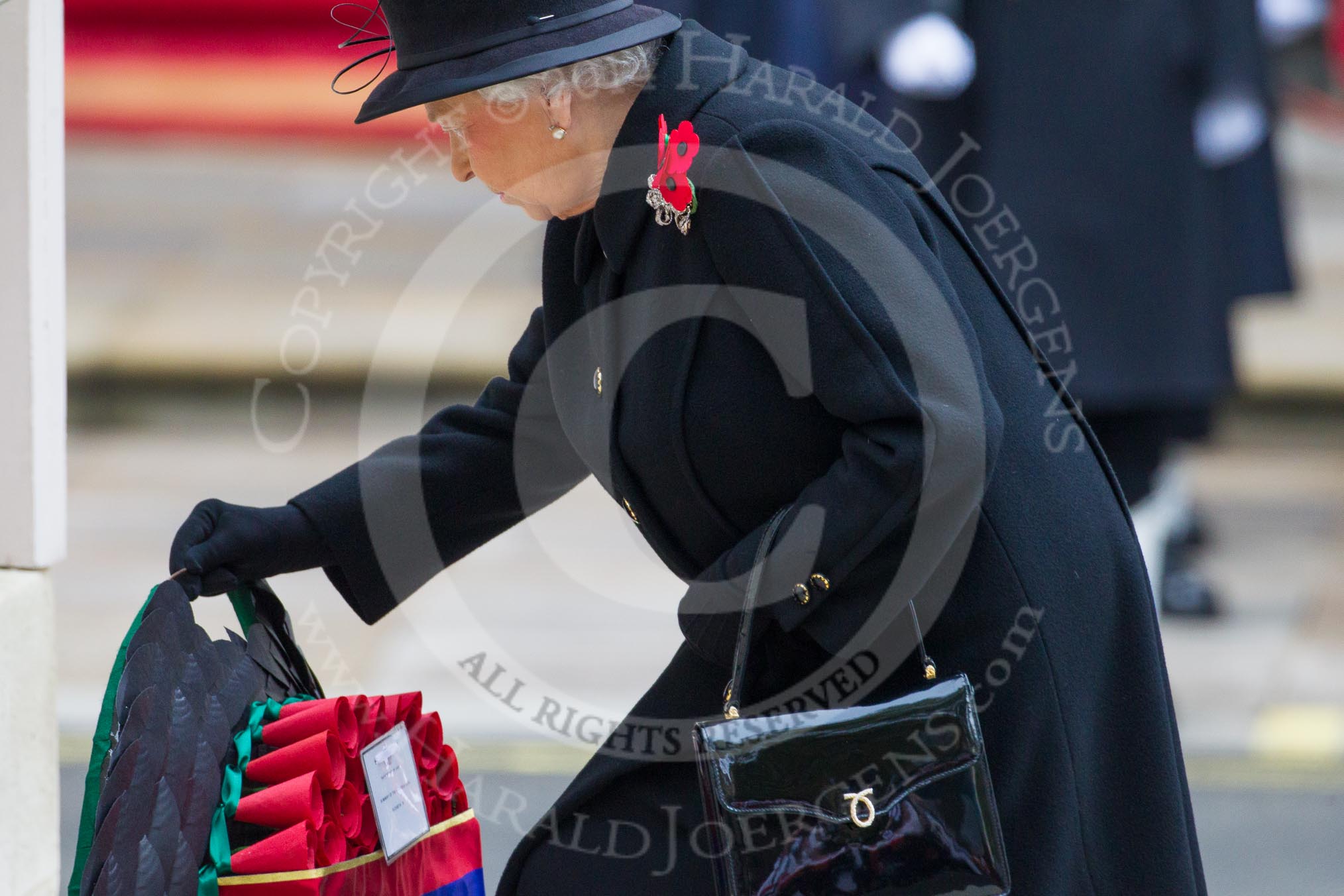 Remembrance Sunday at the Cenotaph in London 2014: HM The Queen laying her wreath at the Cenotaph.
Press stand opposite the Foreign Office building, Whitehall, London SW1,
London,
Greater London,
United Kingdom,
on 09 November 2014 at 11:03, image #186