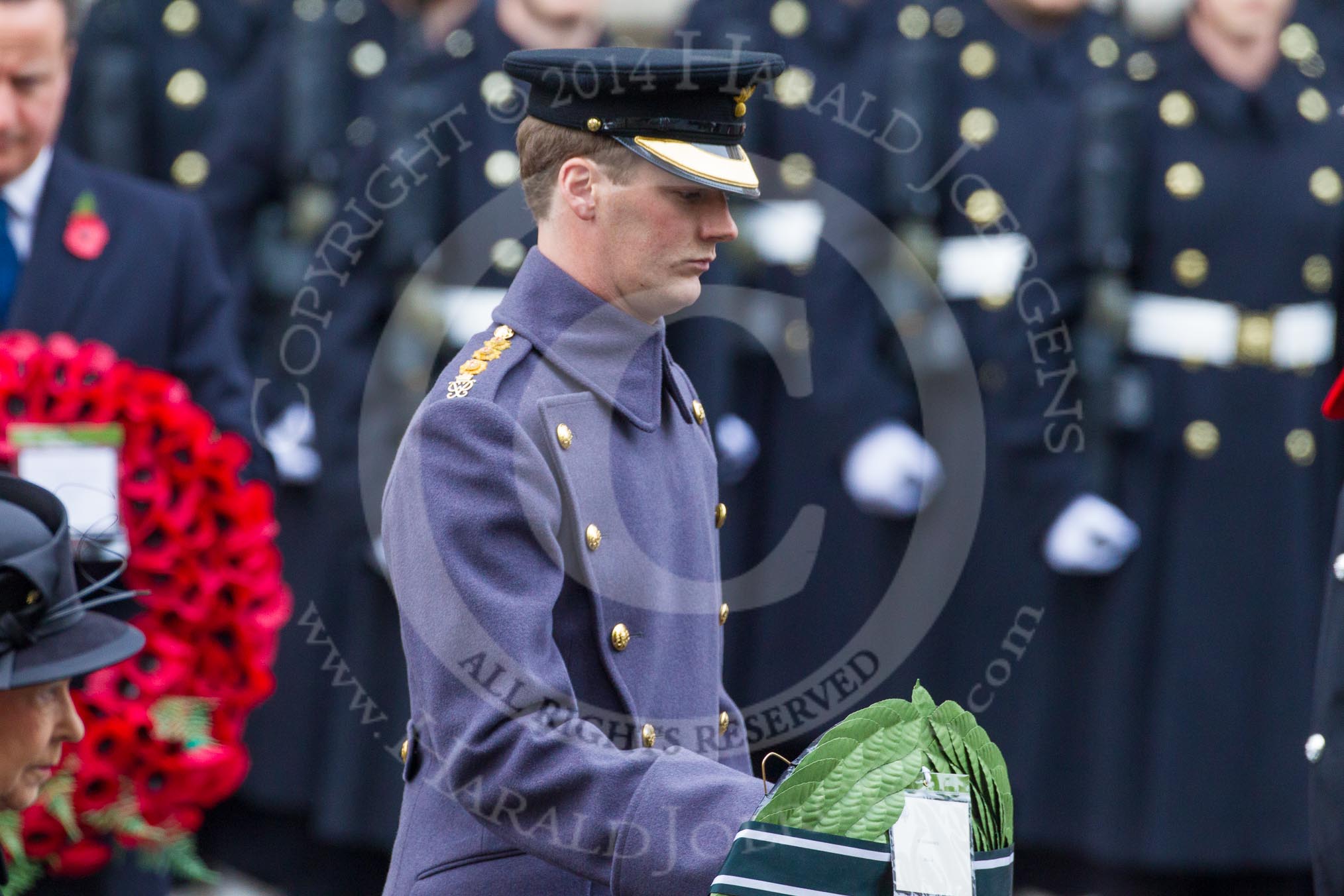 Remembrance Sunday at the Cenotaph in London 2014: Captain Michael Dobson, Equerry to HRH The Duke of Edinburgh, handing over the wreath.
Press stand opposite the Foreign Office building, Whitehall, London SW1,
London,
Greater London,
United Kingdom,
on 09 November 2014 at 11:04, image #189