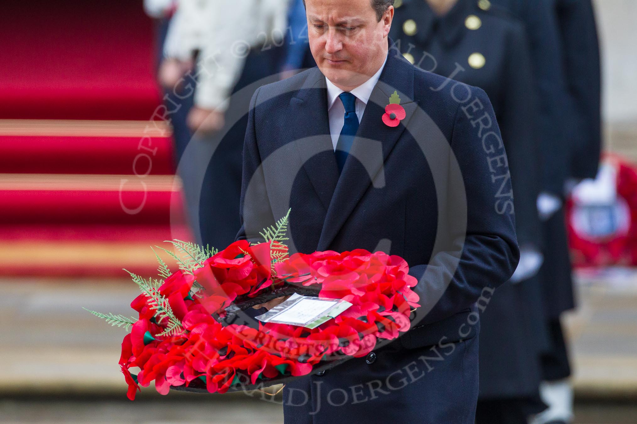 Remembrance Sunday at the Cenotaph in London 2014: Prime Minister David Cameron laying his wreath at the Cenotaph.
Press stand opposite the Foreign Office building, Whitehall, London SW1,
London,
Greater London,
United Kingdom,
on 09 November 2014 at 11:07, image #218