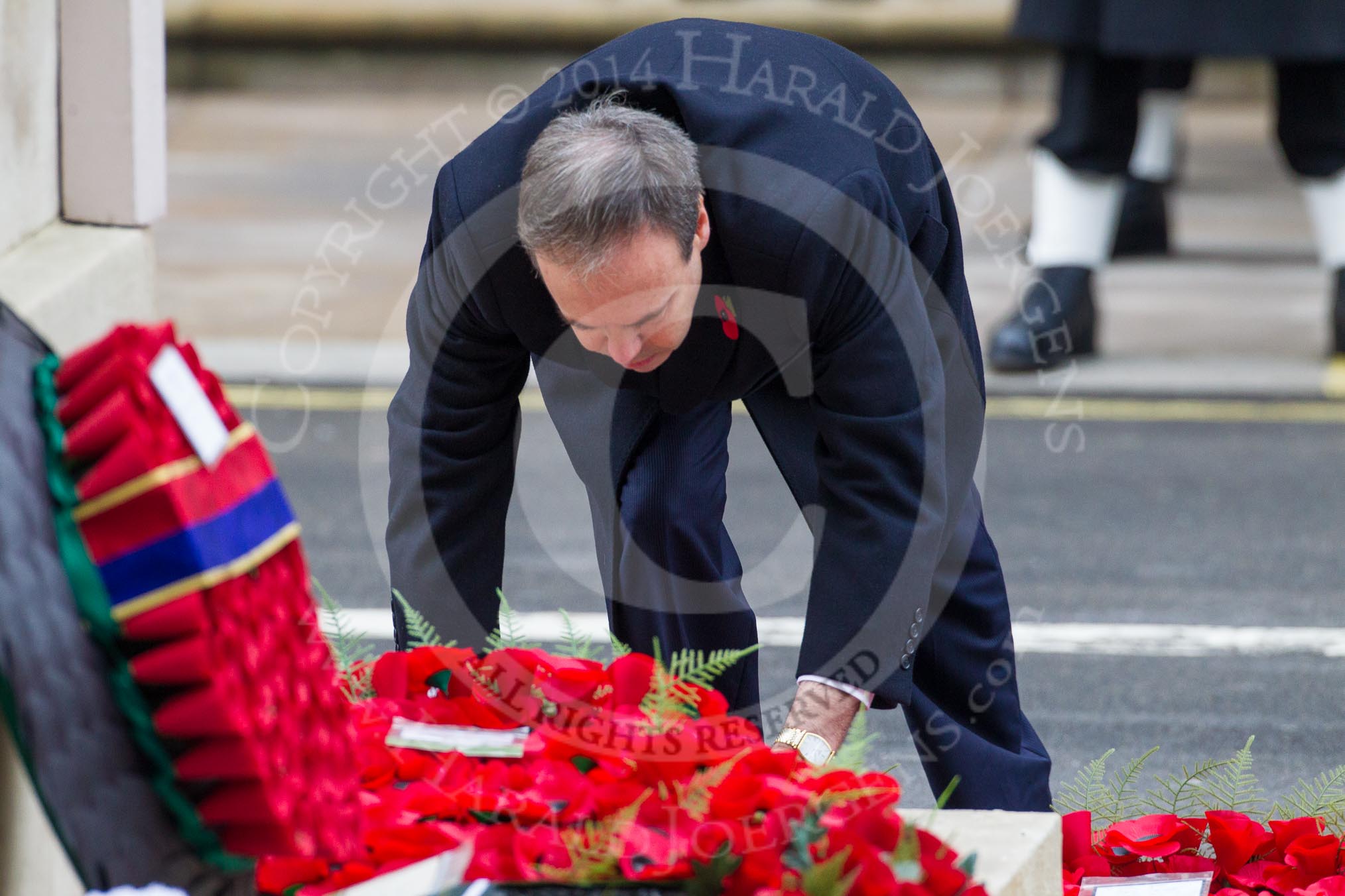 Remembrance Sunday at the Cenotaph in London 2014: The leader of the Democratic Unionist Party, Nigel Dodds, laying his wreath at the Cenotaph.
Press stand opposite the Foreign Office building, Whitehall, London SW1,
London,
Greater London,
United Kingdom,
on 09 November 2014 at 11:08, image #232