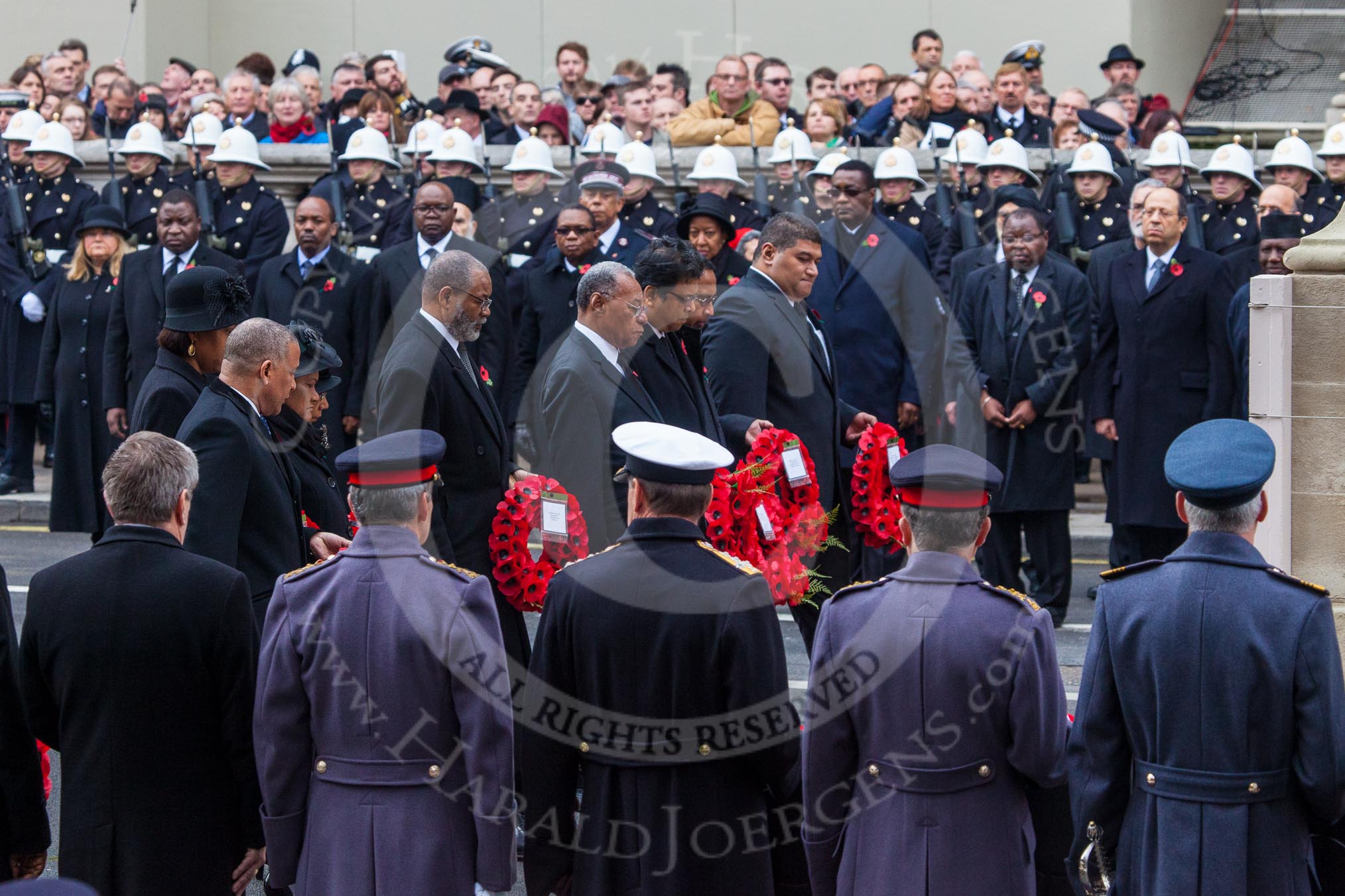 Remembrance Sunday at the Cenotaph in London 2014: The High Commissioners marching toward the Cenotaph to lay their wreaths.
Press stand opposite the Foreign Office building, Whitehall, London SW1,
London,
Greater London,
United Kingdom,
on 09 November 2014 at 11:12, image #251