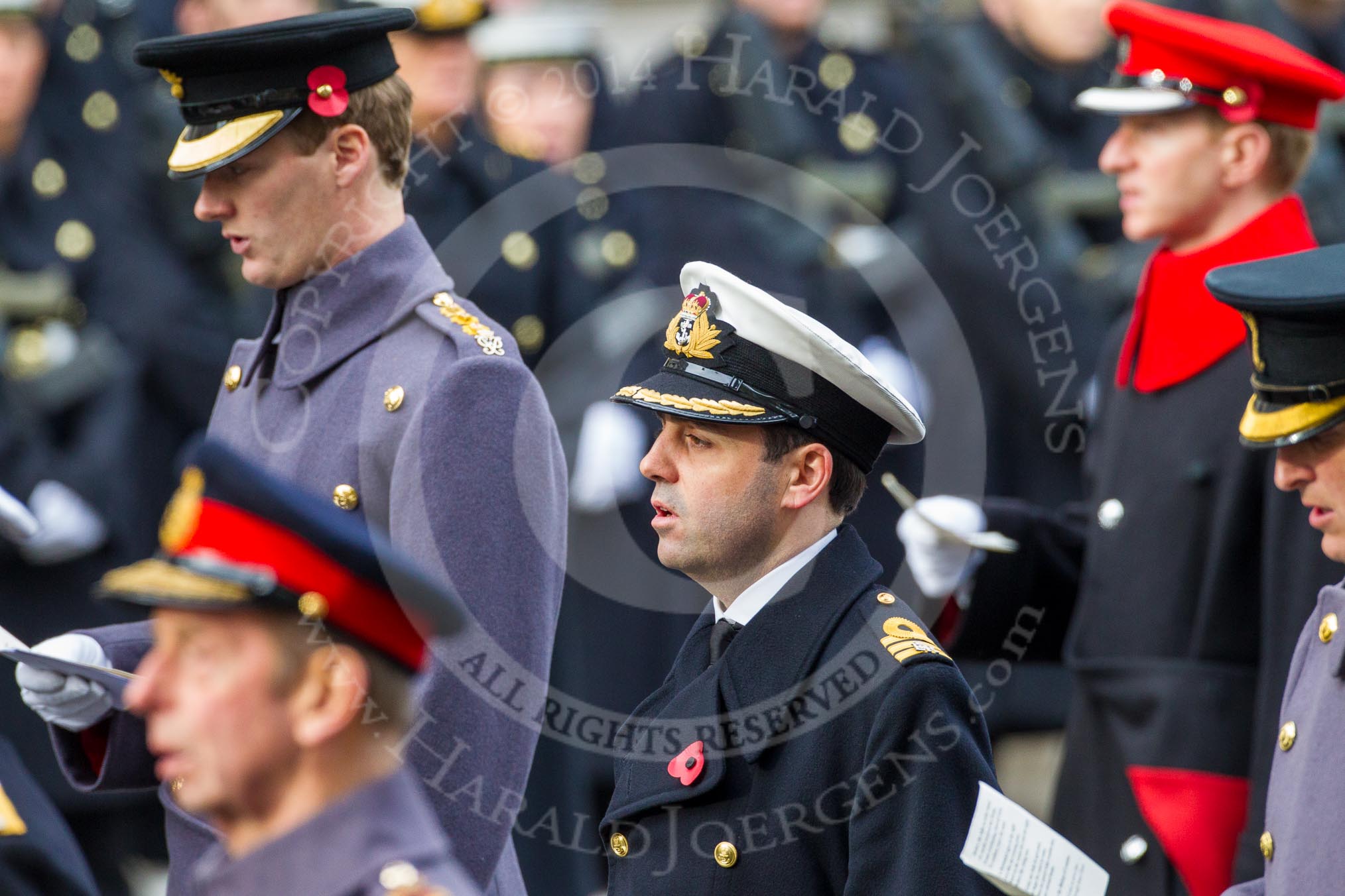 Remembrance Sunday at the Cenotaph in London 2014: Commander Andrew Canale, Royal Navy, equerry to HM The Queen, singing at the service.
Press stand opposite the Foreign Office building, Whitehall, London SW1,
London,
Greater London,
United Kingdom,
on 09 November 2014 at 11:16, image #270