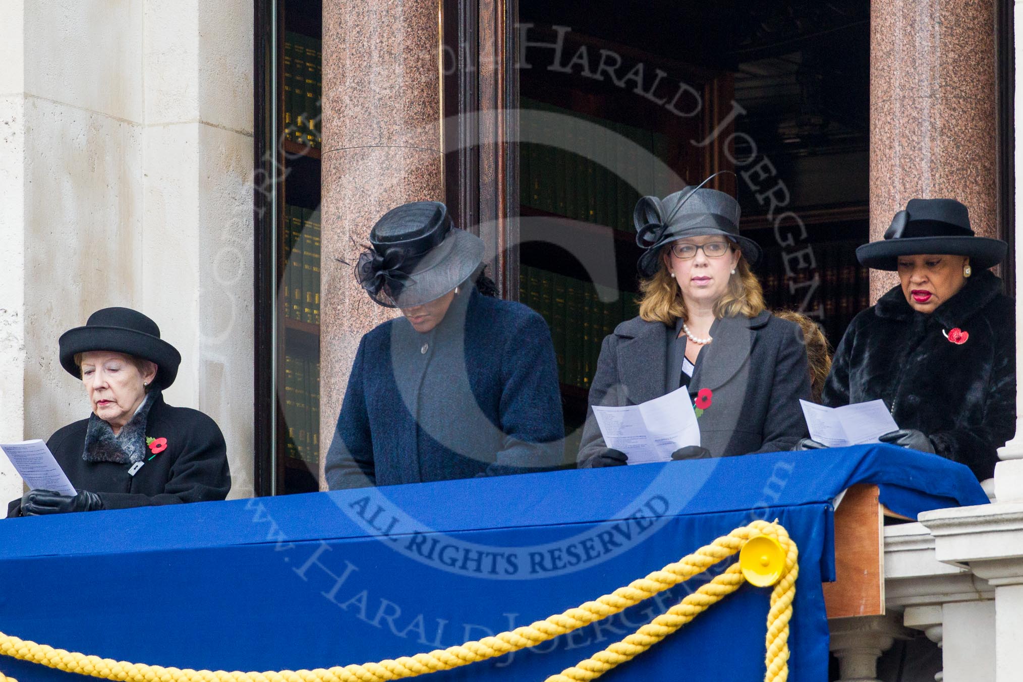 Remembrance Sunday at the Cenotaph in London 2014: Guests singing during the service on one of the balconies of the Foreign- and Commonwealth Office.
Press stand opposite the Foreign Office building, Whitehall, London SW1,
London,
Greater London,
United Kingdom,
on 09 November 2014 at 11:17, image #277