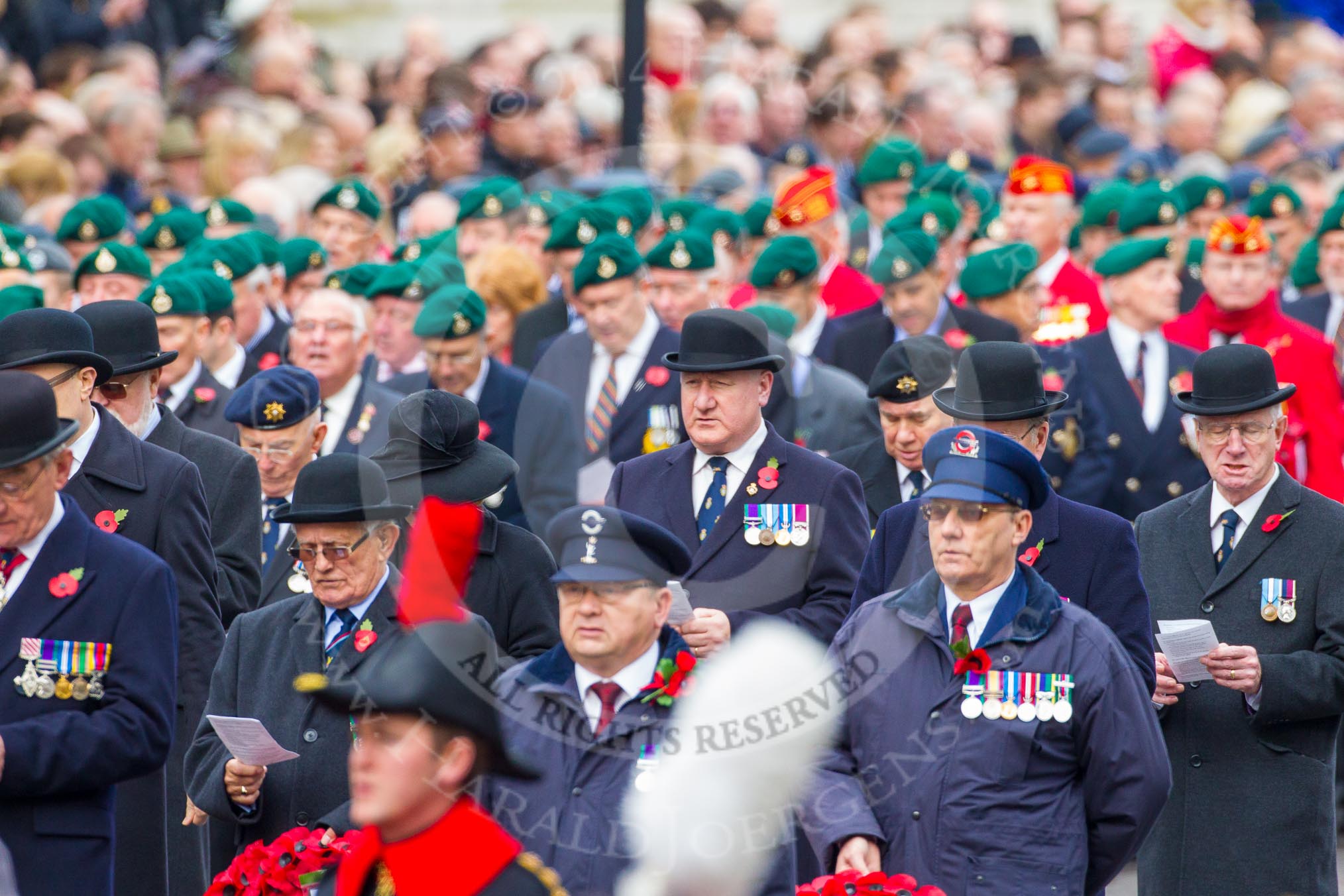 Remembrance Sunday at the Cenotaph in London 2014: The representatives of the major charities and the veterans waiting for the March Past singing during the service.
Press stand opposite the Foreign Office building, Whitehall, London SW1,
London,
Greater London,
United Kingdom,
on 09 November 2014 at 11:18, image #283