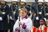 Remembrance Sunday at the Cenotaph in London 2014: The Cross-Bearer Harry Bradford, followed by the choir.
Press stand opposite the Foreign Office building, Whitehall, London SW1,
London,
Greater London,
United Kingdom,
on 09 November 2014 at 10:53, image #101
