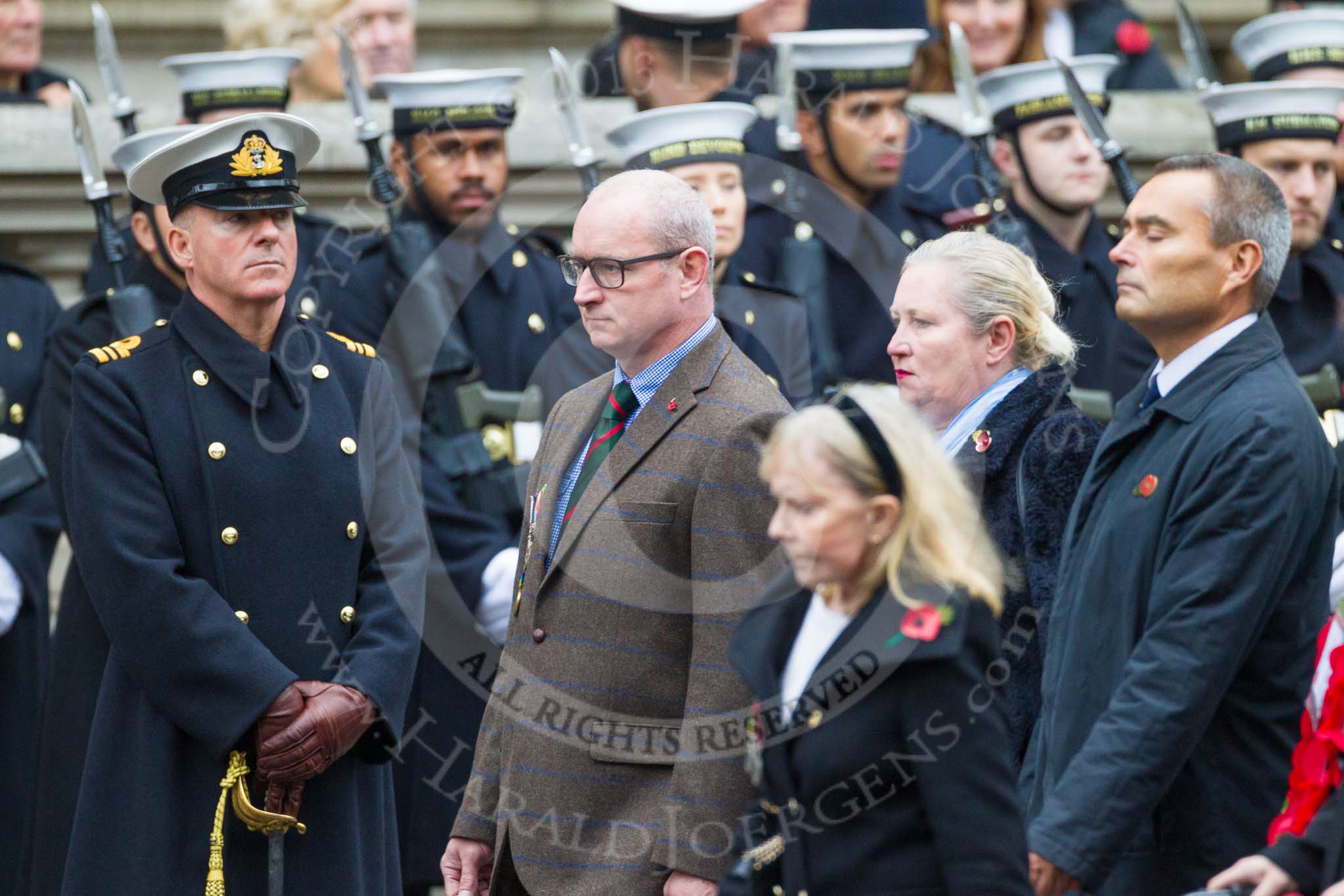 Remembrance Sunday at the Cenotaph 2015: Group M23, Civilians Representing Families.
Cenotaph, Whitehall, London SW1,
London,
Greater London,
United Kingdom,
on 08 November 2015 at 12:17, image #1556