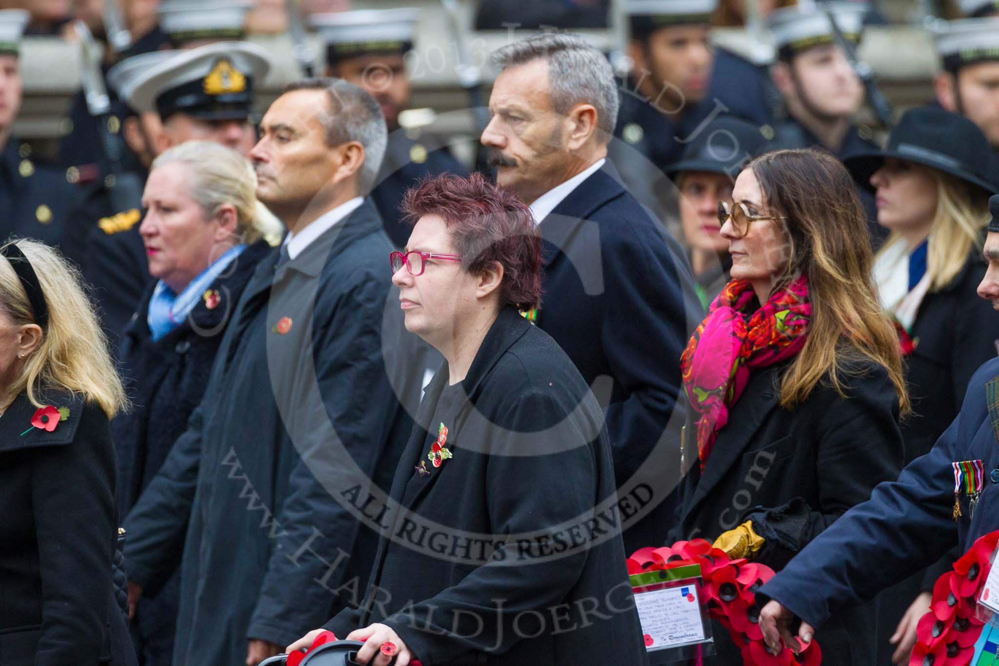 Remembrance Sunday at the Cenotaph 2015: Group M23, Civilians Representing Families.
Cenotaph, Whitehall, London SW1,
London,
Greater London,
United Kingdom,
on 08 November 2015 at 12:17, image #1557