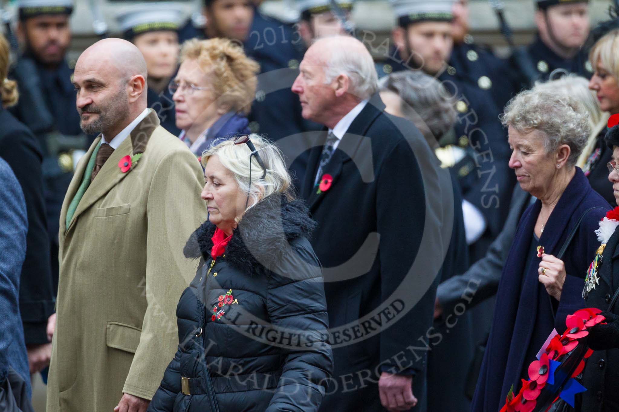 Remembrance Sunday at the Cenotaph 2015: Group M23, Civilians Representing Families.
Cenotaph, Whitehall, London SW1,
London,
Greater London,
United Kingdom,
on 08 November 2015 at 12:17, image #1572