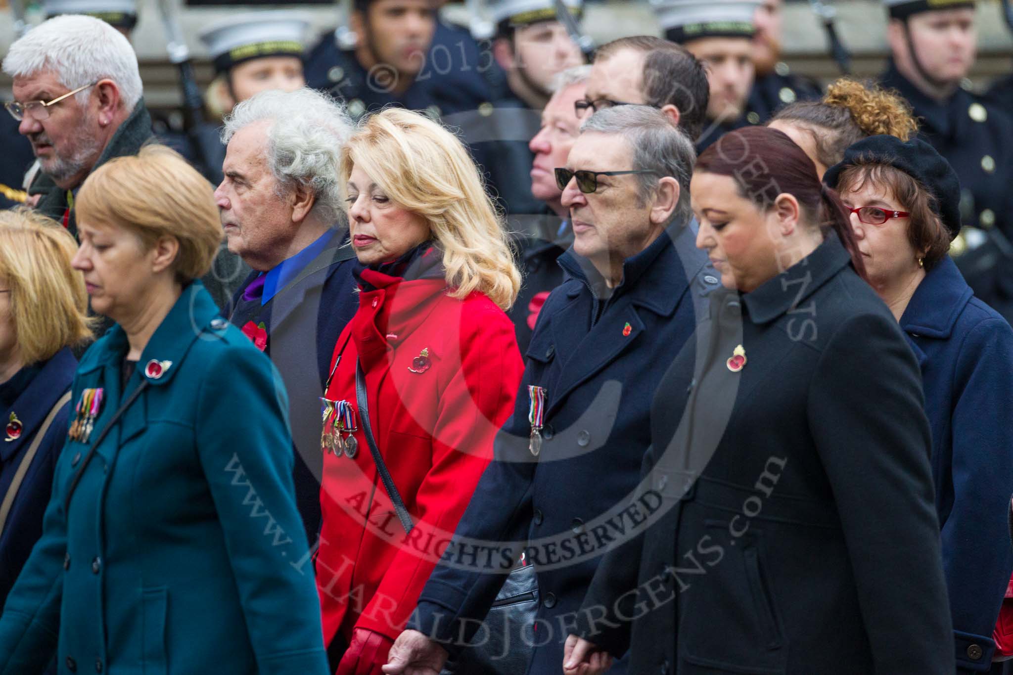 Remembrance Sunday at the Cenotaph 2015: Group M23, Civilians Representing Families.
Cenotaph, Whitehall, London SW1,
London,
Greater London,
United Kingdom,
on 08 November 2015 at 12:17, image #1580