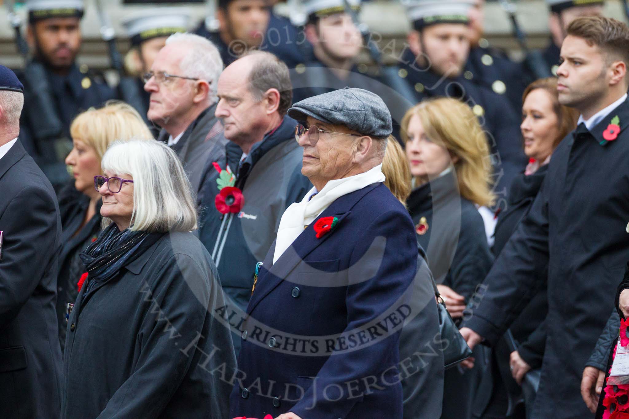 Remembrance Sunday at the Cenotaph 2015: Group M23, Civilians Representing Families.
Cenotaph, Whitehall, London SW1,
London,
Greater London,
United Kingdom,
on 08 November 2015 at 12:17, image #1584