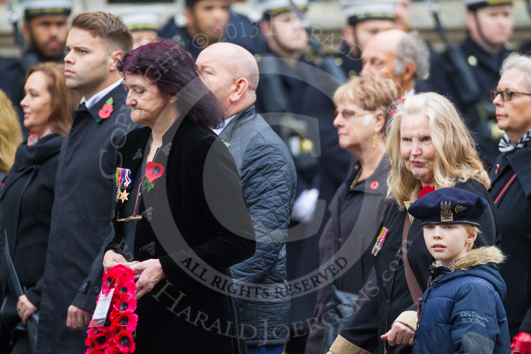 Remembrance Sunday at the Cenotaph 2015: Group M23, Civilians Representing Families.
Cenotaph, Whitehall, London SW1,
London,
Greater London,
United Kingdom,
on 08 November 2015 at 12:17, image #1585