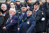 Remembrance Sunday at the Cenotaph 2015: Group E32, Fleet Air Arm Armourers Association.
Cenotaph, Whitehall, London SW1,
London,
Greater London,
United Kingdom,
on 08 November 2015 at 12:03, image #976