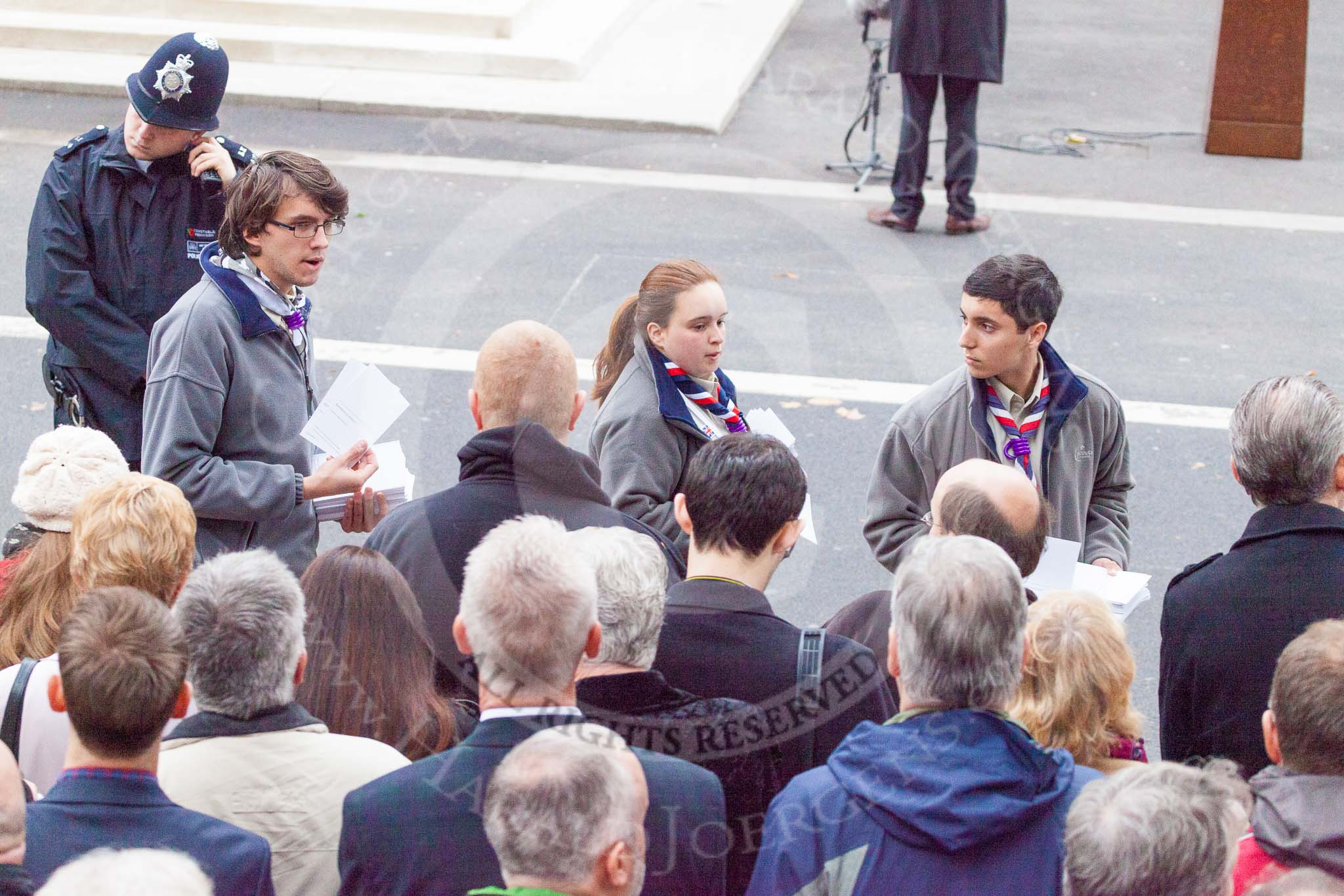 Remembrance Sunday at the Cenotaph 2015: Scouts distributing leaflets with information about the service. Image #12, 08 November 2015 09:18 Whitehall, London, UK