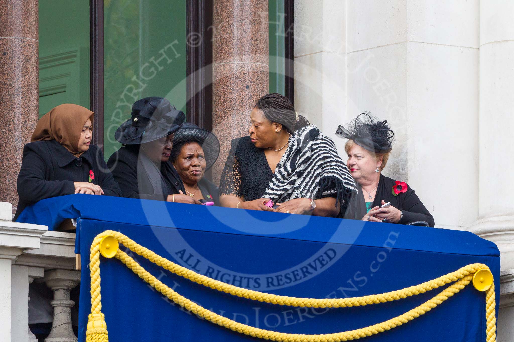 Remembrance Sunday at the Cenotaph 2015: Guests on one of the balconies of the Foreign- and Commonwealth Office Building. Image #40, 08 November 2015 10:19 Whitehall, London, UK