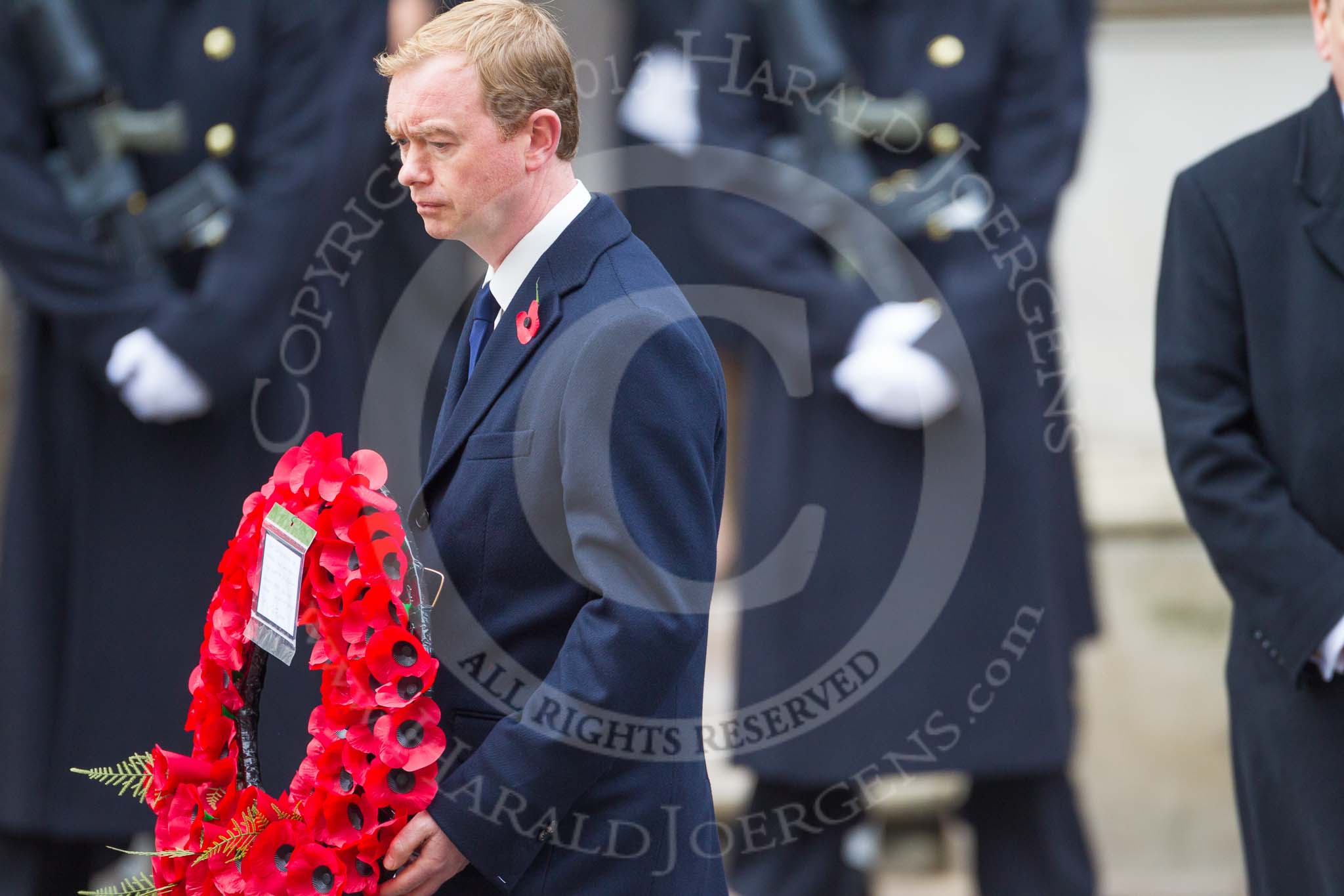 Remembrance Sunday at the Cenotaph 2015: The Leader of the Liberal Democrats, Tim Fallon, walking towards the Cenotaph with his wreath. Image #217, 08 November 2015 11:07 Whitehall, London, UK