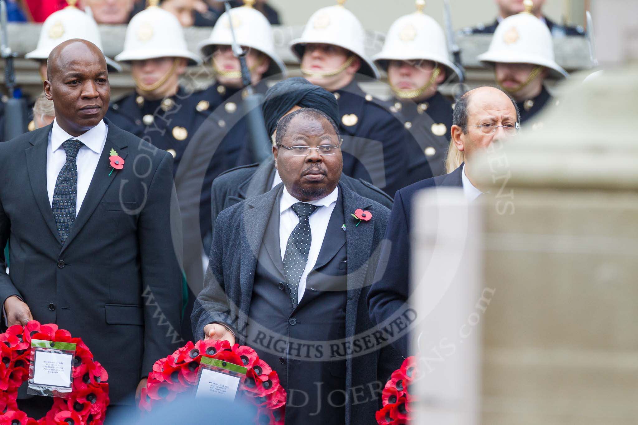 Remembrance Sunday at the Cenotaph 2015: The High Commissioner of Tanzania, the Deputy High Commissioner of Sierra Leone, and the High Commissioner of Cyprus with their wreaths at the Cenotaph. Image #224, 08 November 2015 11:09 Whitehall, London, UK