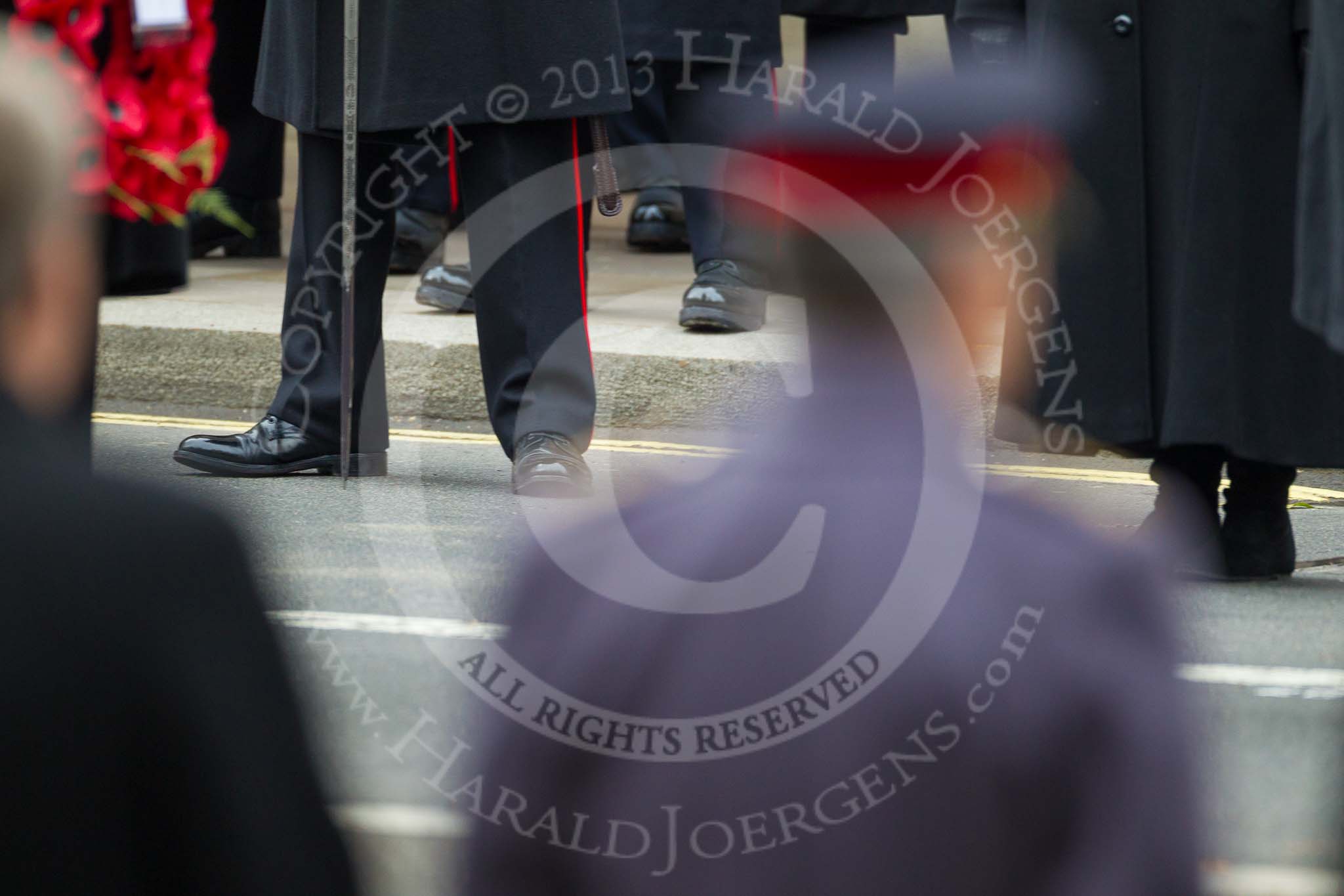 Remembrance Sunday at the Cenotaph 2015: The feet of a Royal Marine's officer seen between the head of the army and navy (both out of focus). Image #237, 08 November 2015 11:09 Whitehall, London, UK