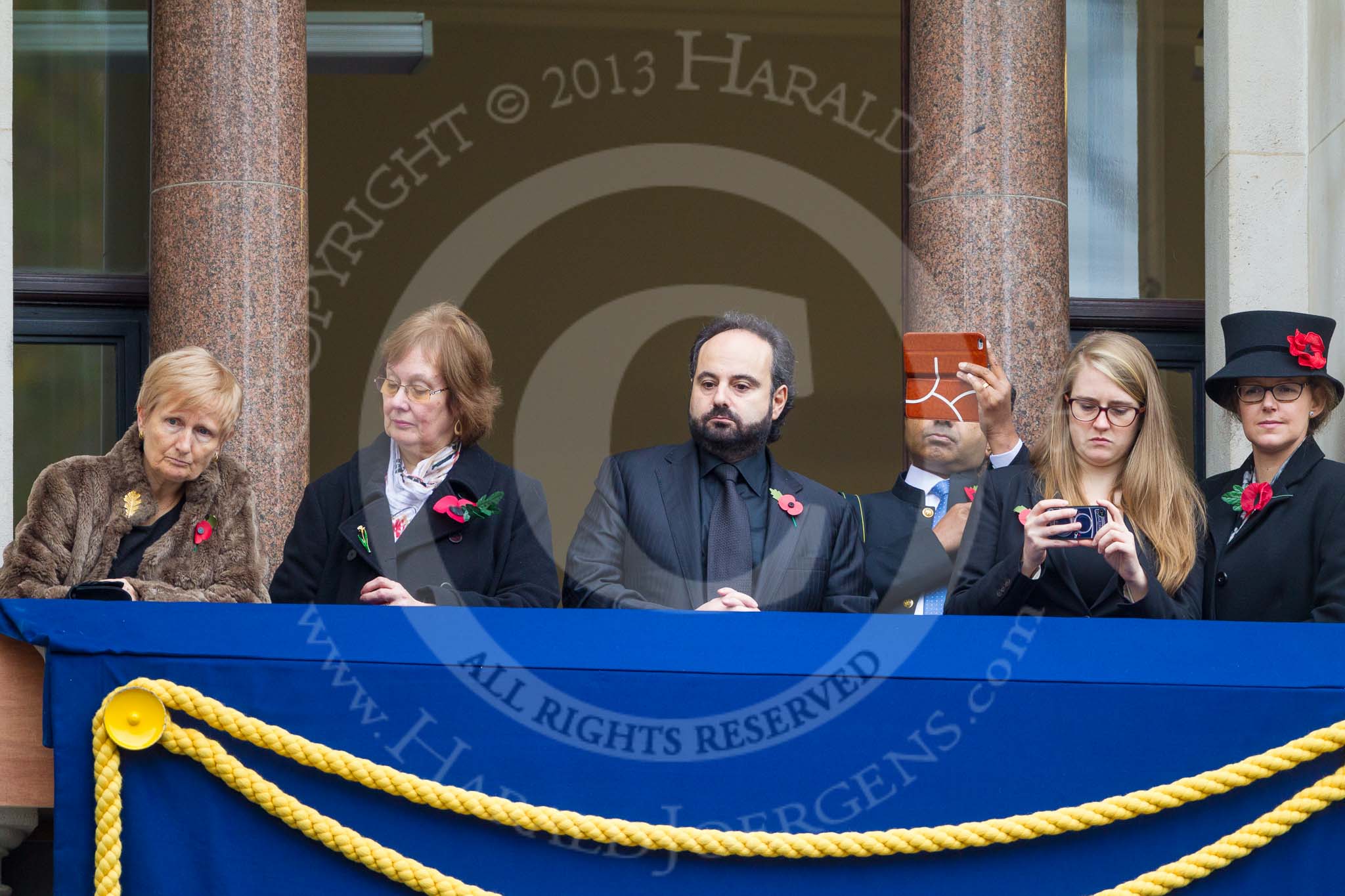 Remembrance Sunday at the Cenotaph 2015: Guests watching the ceremony from one of the balconies of the Foreign- and Commonwealth Office. Image #257, 08 November 2015 11:11 Whitehall, London, UK