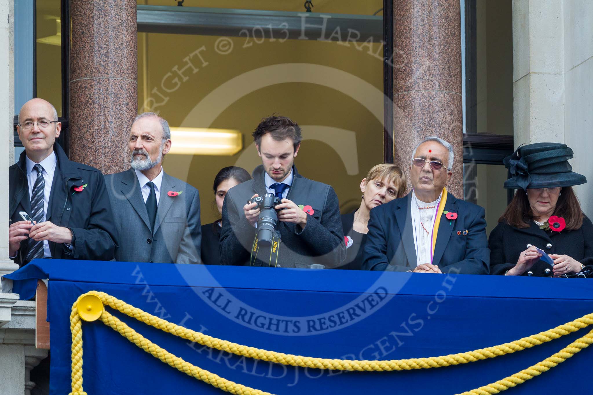 Remembrance Sunday at the Cenotaph 2015: Guests watching the ceremony from one of the balconies of the Foreign- and Commonwealth Office. Image #258, 08 November 2015 11:11 Whitehall, London, UK