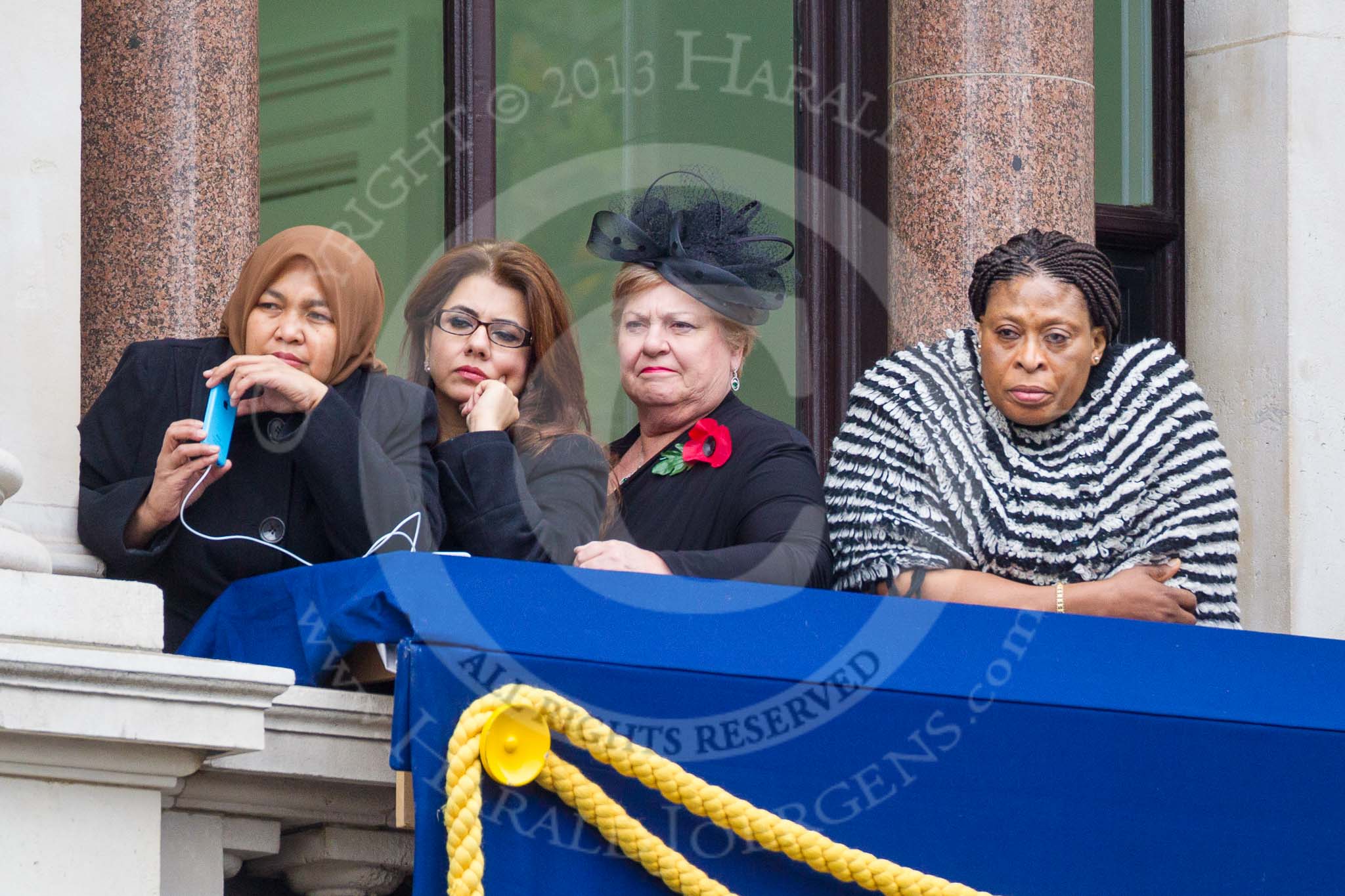 Remembrance Sunday at the Cenotaph 2015: Guests watching the ceremony from one of the balconies of the Foreign- and Commonwealth Office. Image #262, 08 November 2015 11:12 Whitehall, London, UK